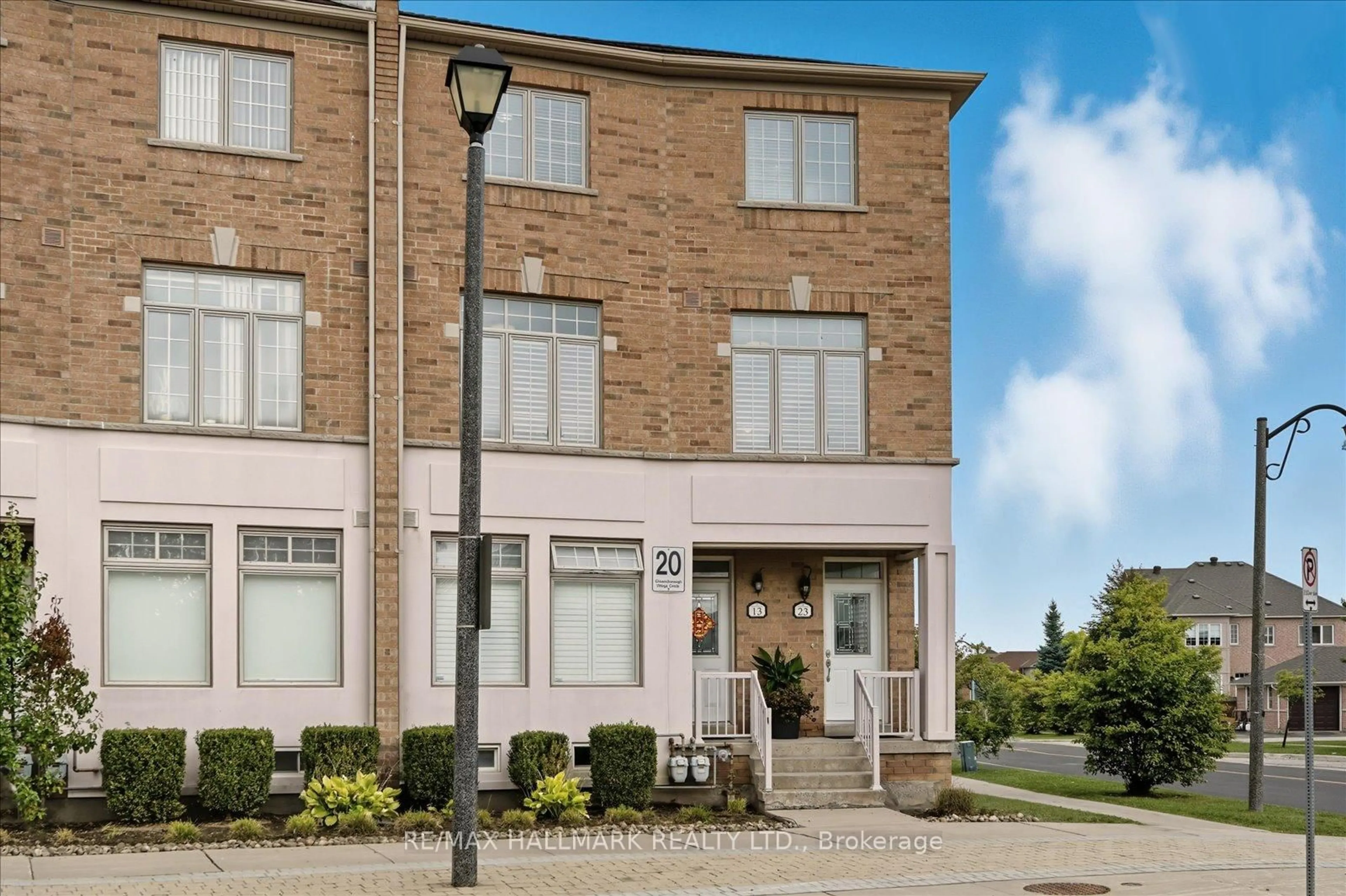 Home with brick exterior material, street for 20 Greensborough Villag Circ #23, Markham Ontario L6E 1M4