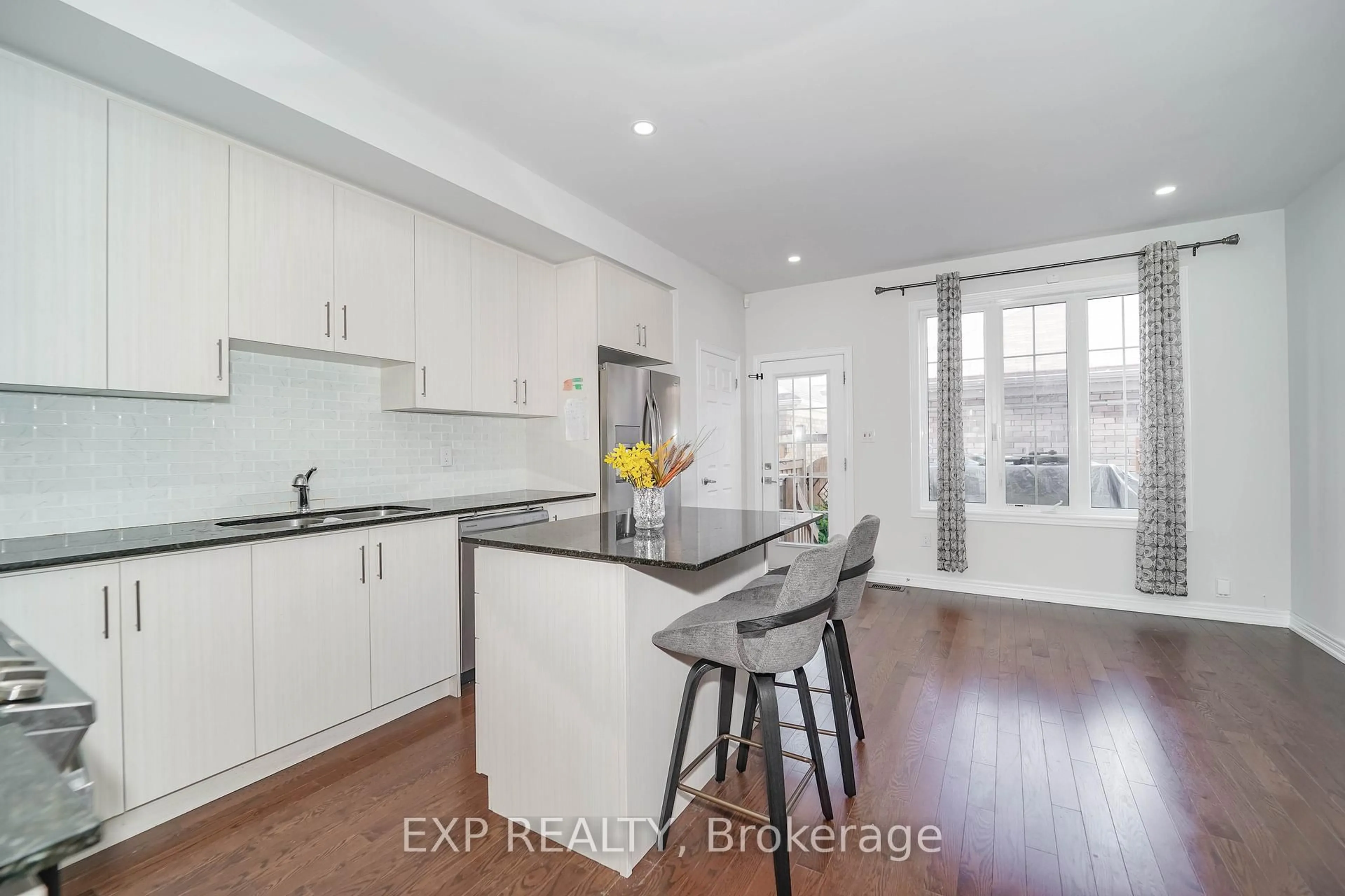Open concept kitchen, wood/laminate floor for 62 Harvest Field Rd, Markham Ontario L6B 0T7