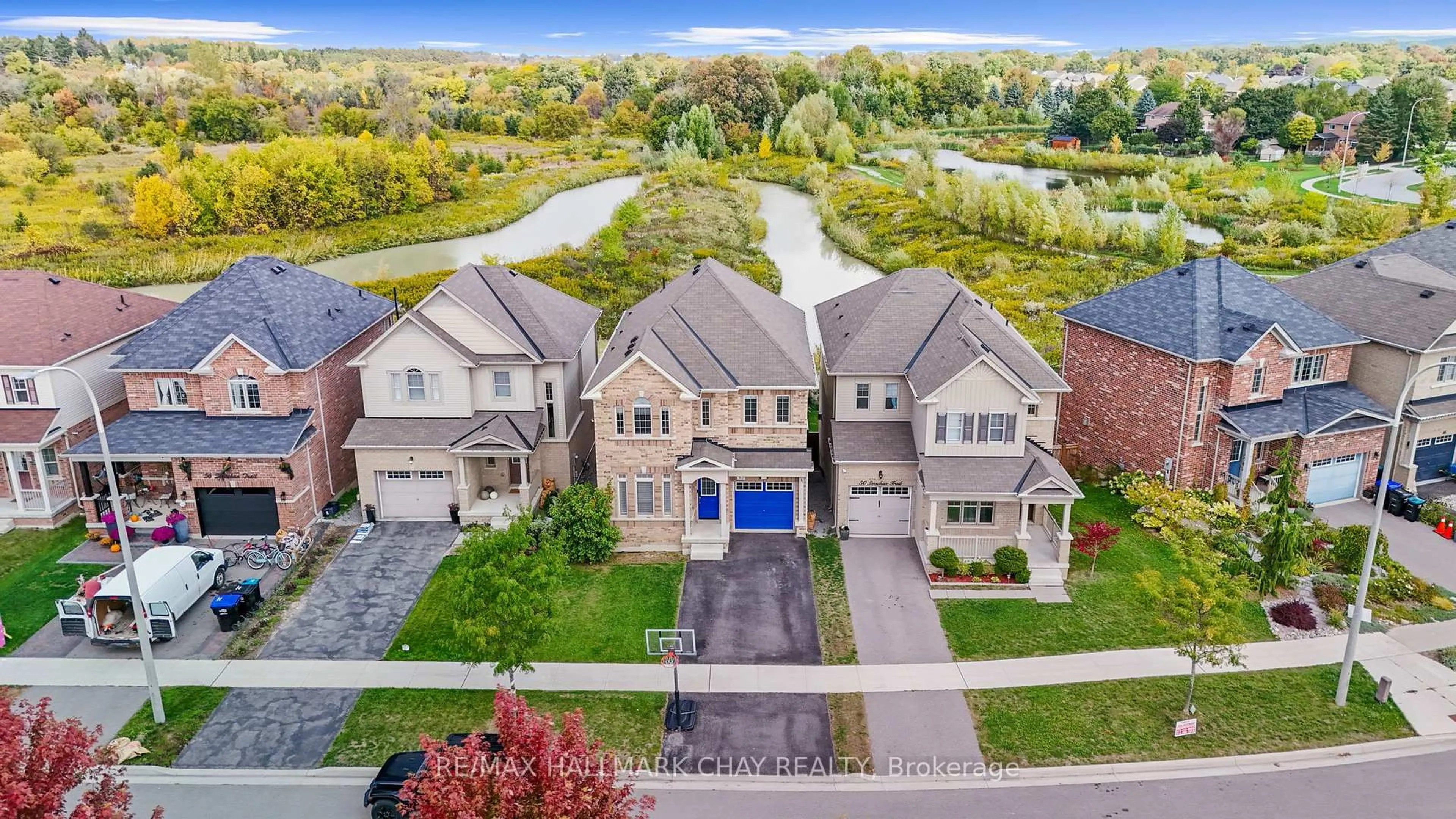 A pic from outside/outdoor area/front of a property/back of a property/a pic from drone, street for 52 Strachan Tr, New Tecumseth Ontario L0G 1A0