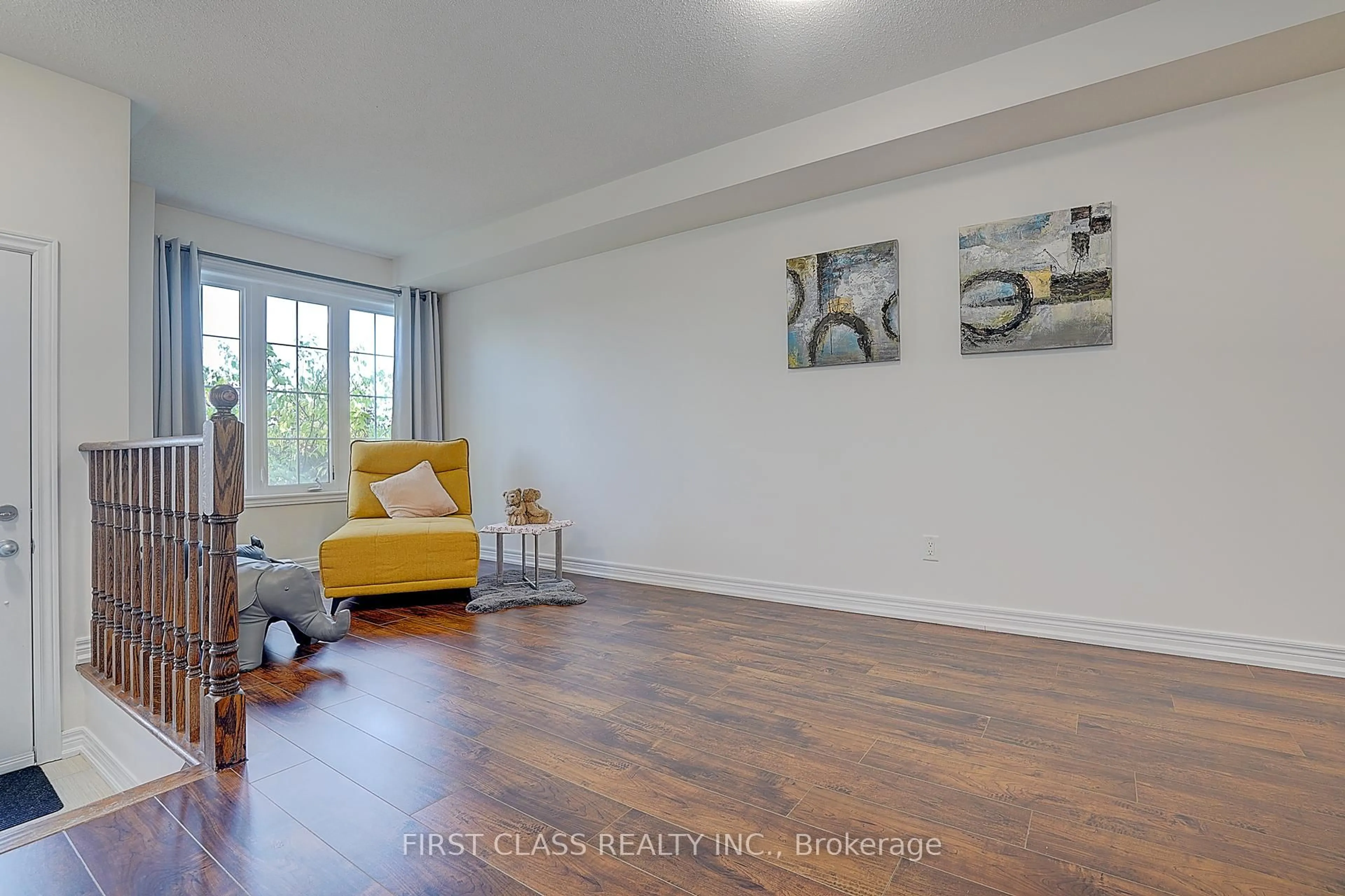 Living room with furniture, wood/laminate floor for 5303 Major Mackenzie Dr, Markham Ontario L6C 0N3
