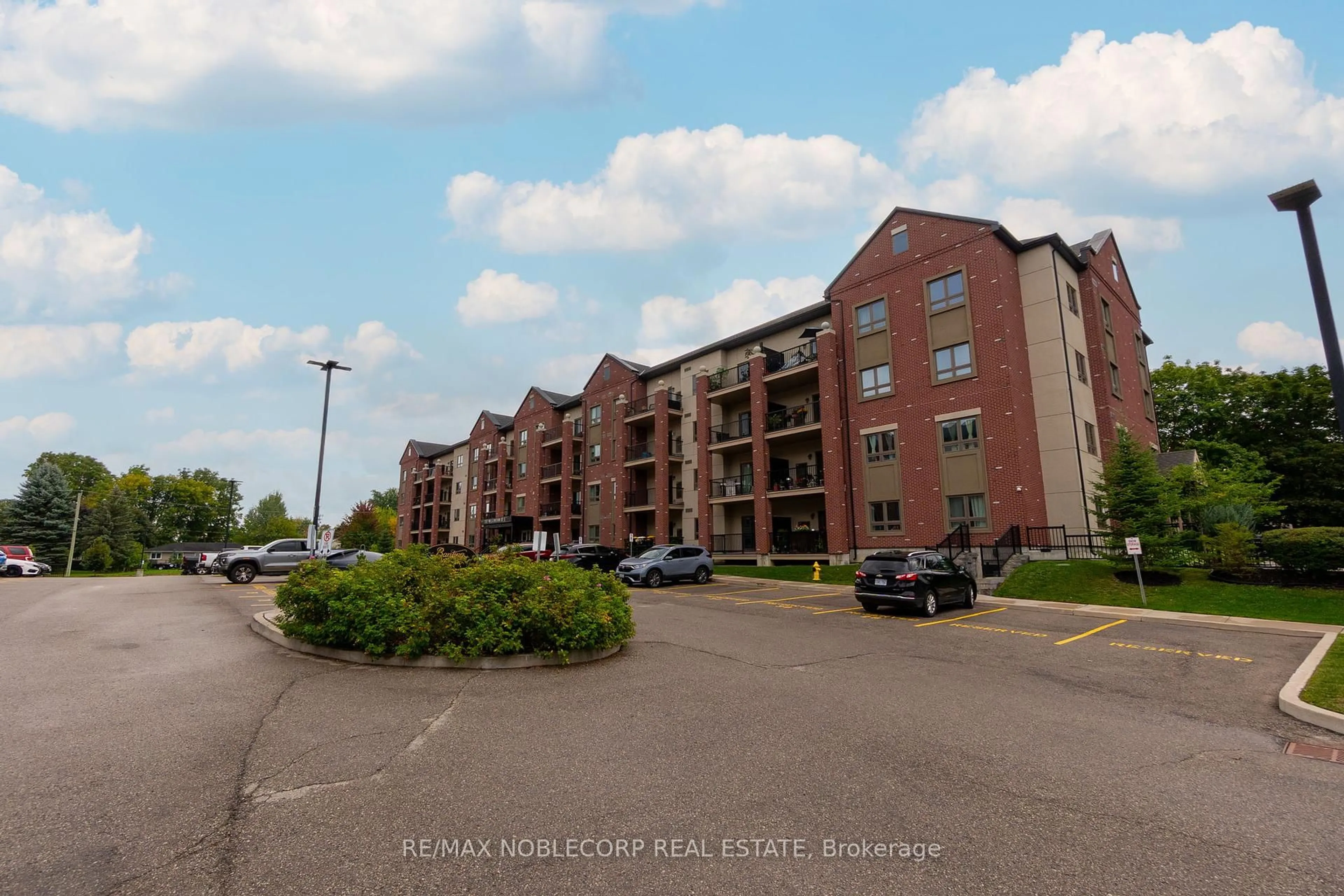 A pic from outside/outdoor area/front of a property/back of a property/a pic from drone, street for 157 Wellington St #206, New Tecumseth Ontario L9R 0R7
