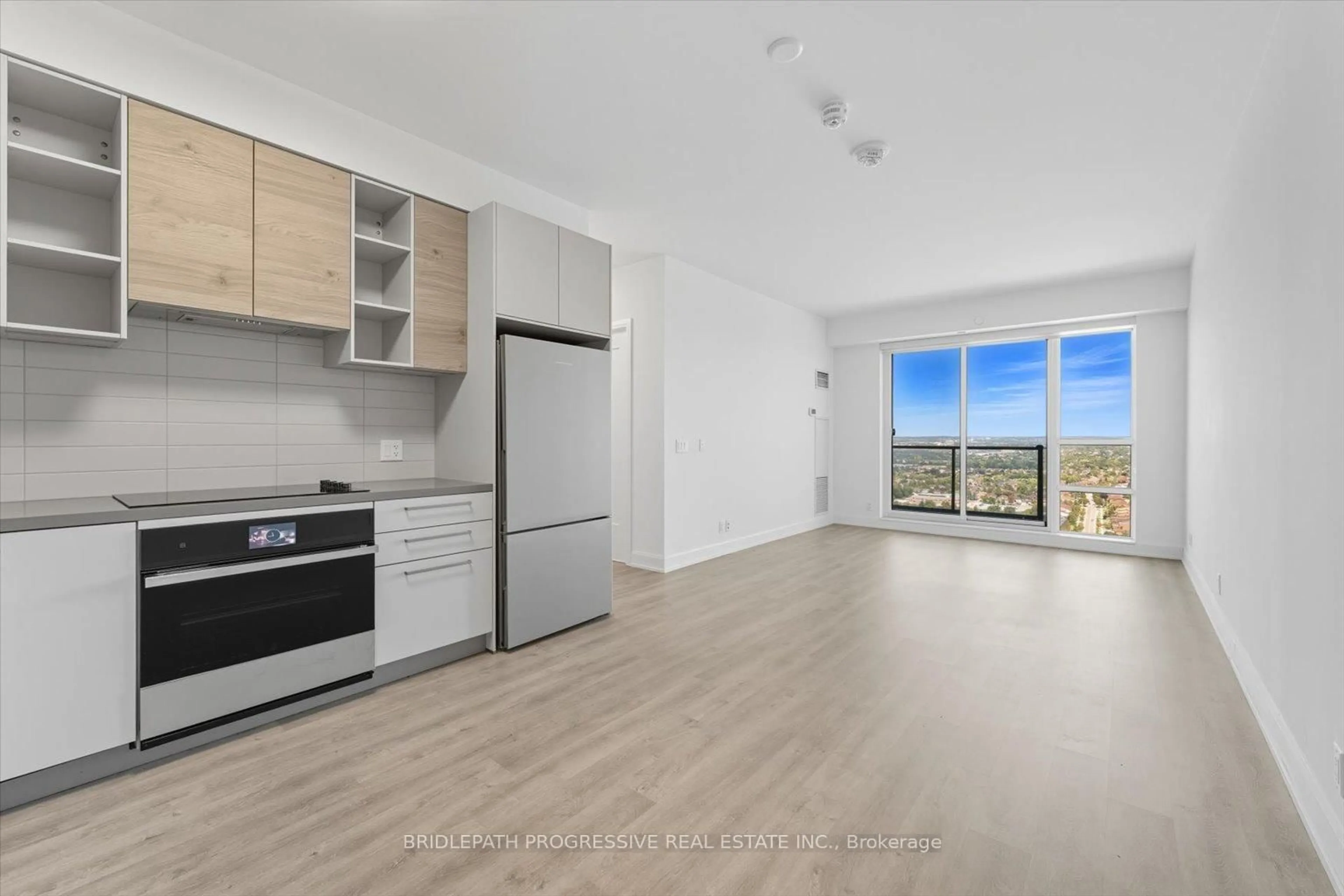 Open concept kitchen, wood/laminate floor for 38 Gandhi Lane #3212, Markham Ontario L3T 0G9