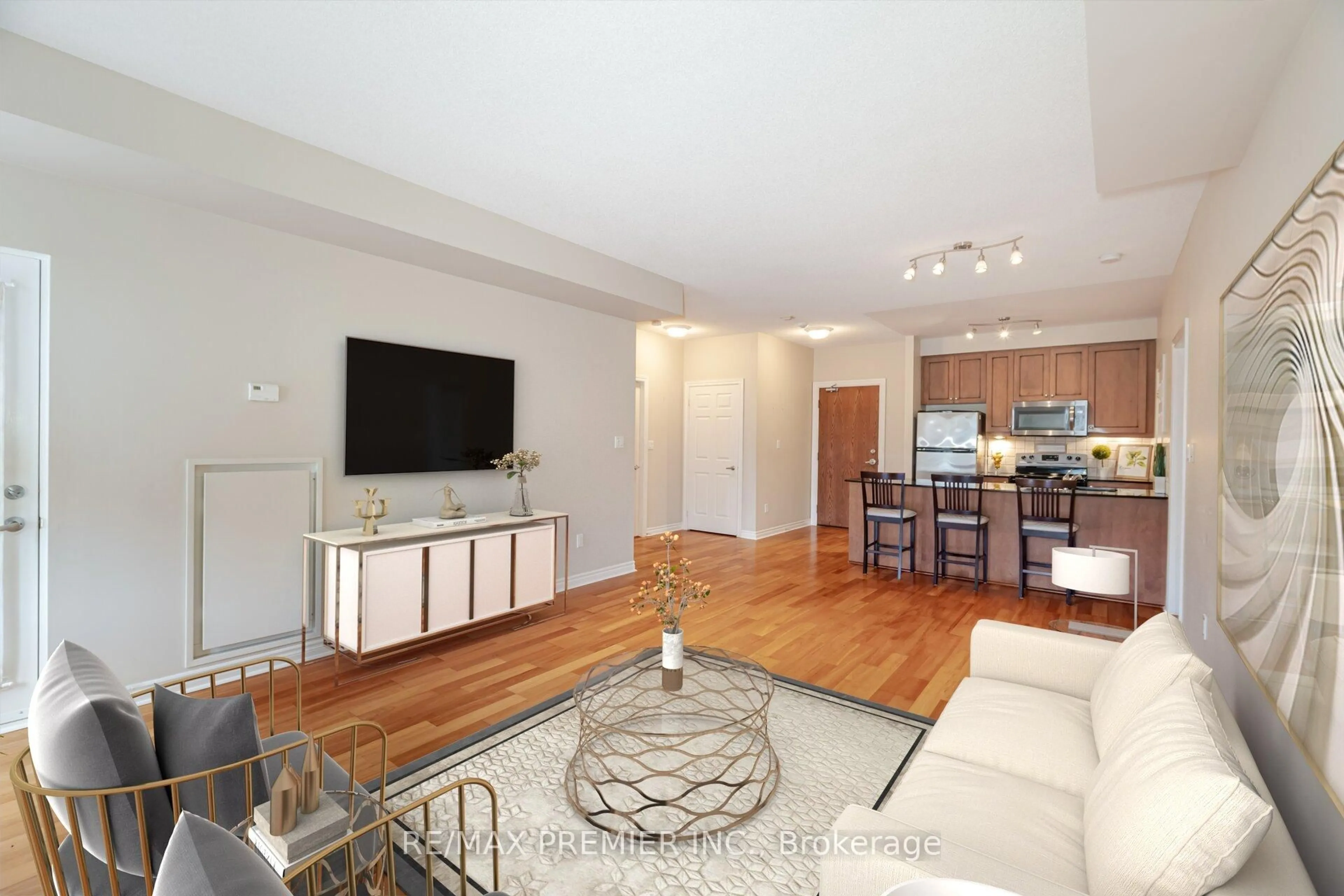 Living room with furniture, wood/laminate floor for 4620 Highway 7 #306, Vaughan Ontario L4L 0B3
