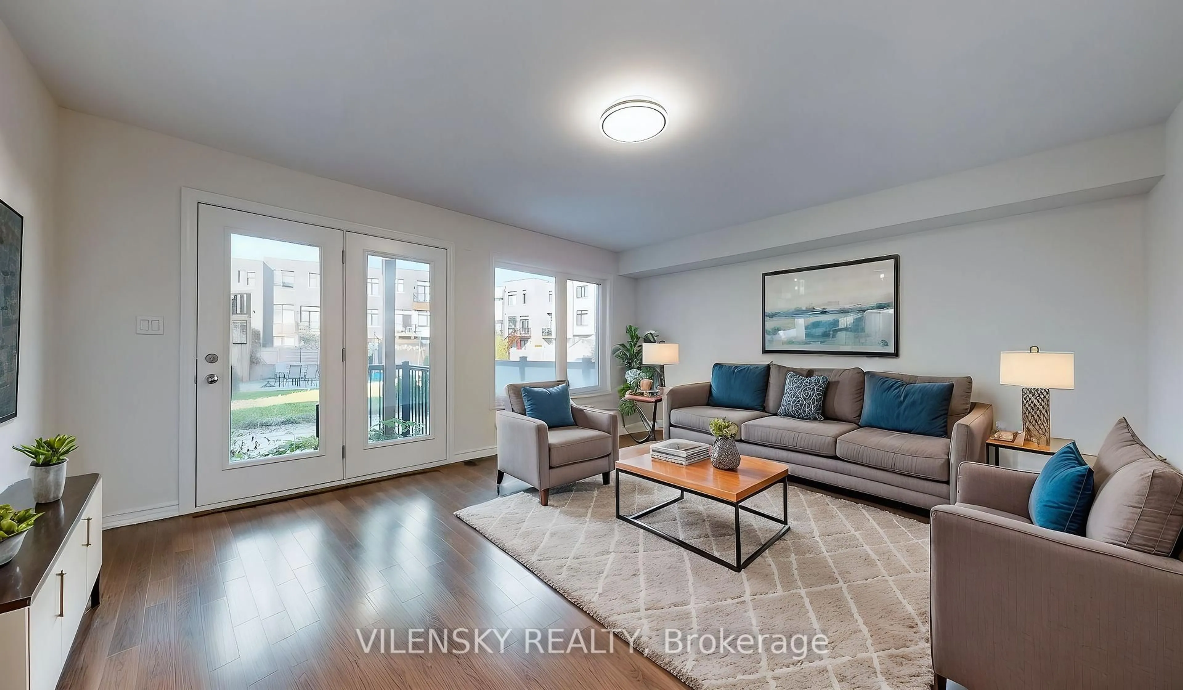 Living room with furniture, wood/laminate floor for 119 Golden Tr, Vaughan Ontario L6A 4J5