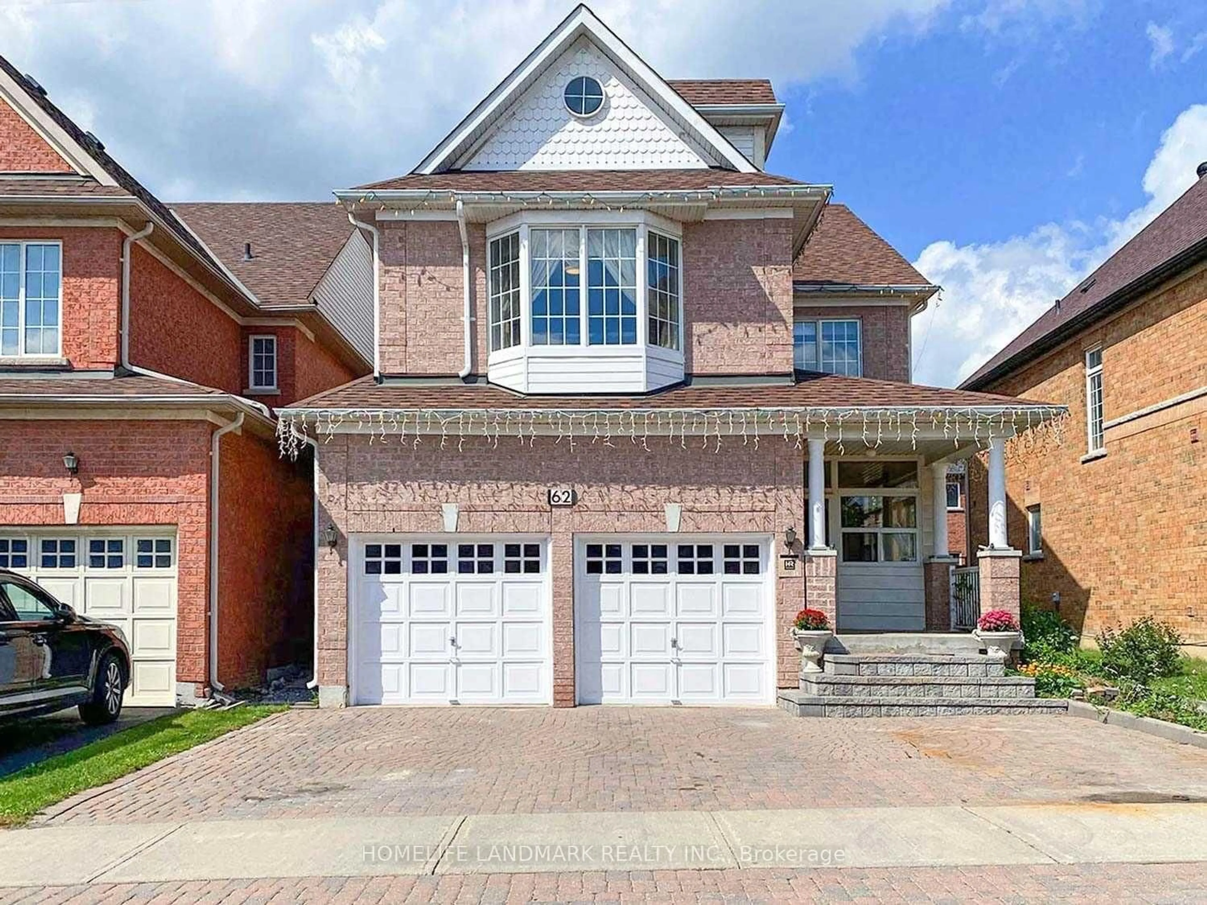 Home with brick exterior material, street for 62 Elmrill Rd, Markham Ontario L6C 2P1
