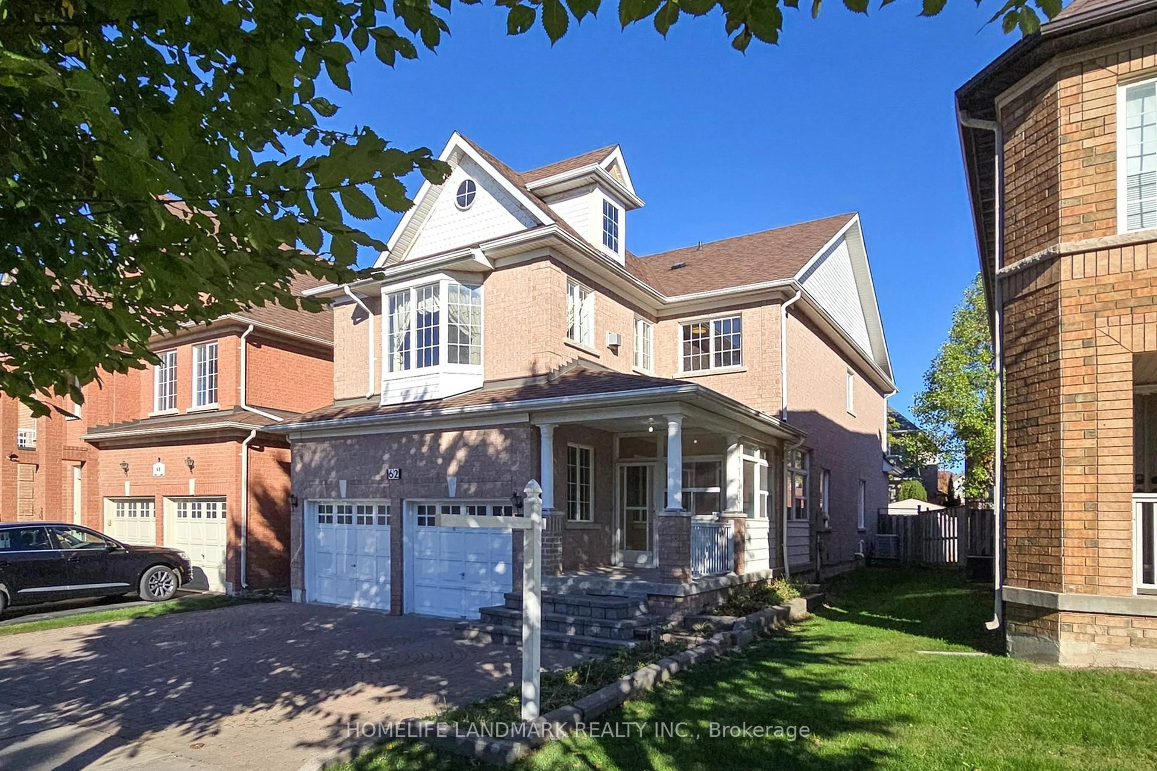 Home with brick exterior material, street for 62 Elmrill Rd, Markham Ontario L6C 2P1