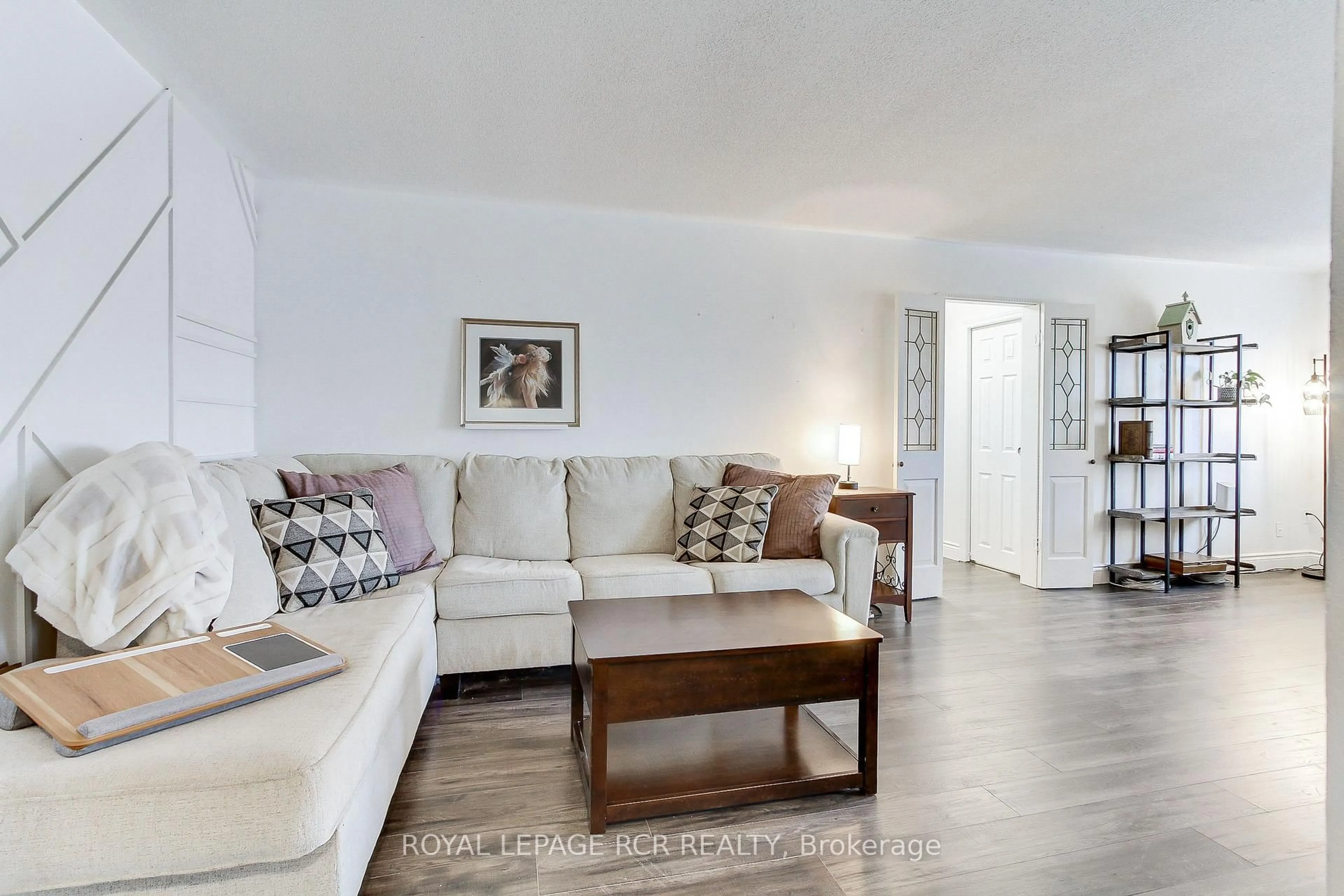 Living room with furniture, wood/laminate floor for 136 Scanlon Ave, Bradford West Gwillimbury Ontario L3Z 1G6