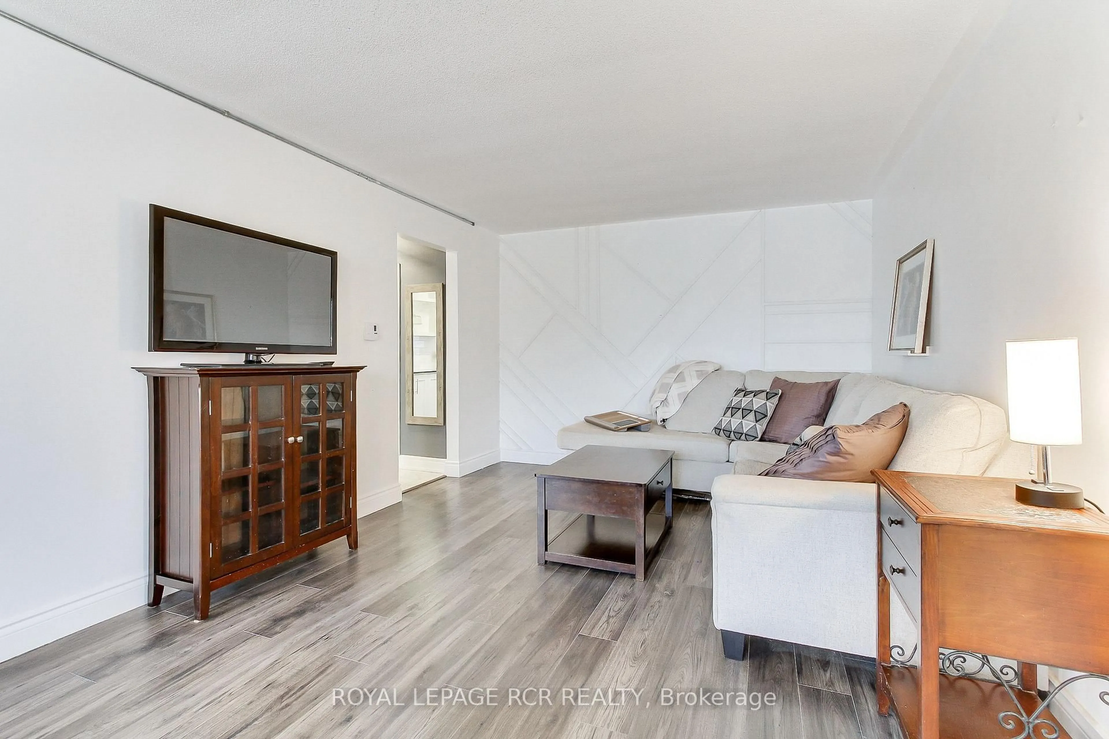 Living room with furniture, wood/laminate floor for 136 Scanlon Ave, Bradford West Gwillimbury Ontario L3Z 1G6