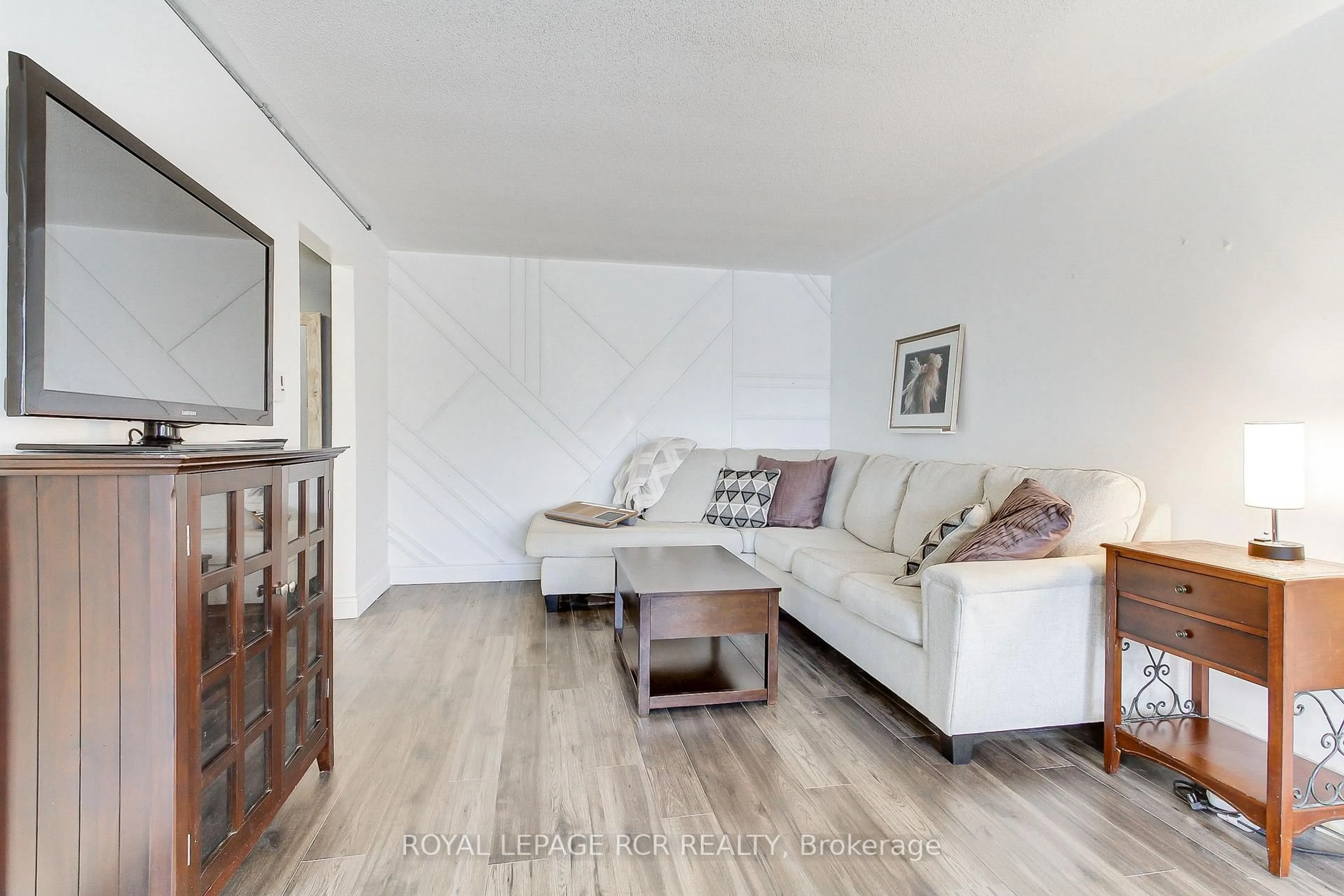 Living room with furniture, wood/laminate floor for 136 Scanlon Ave, Bradford West Gwillimbury Ontario L3Z 1G6