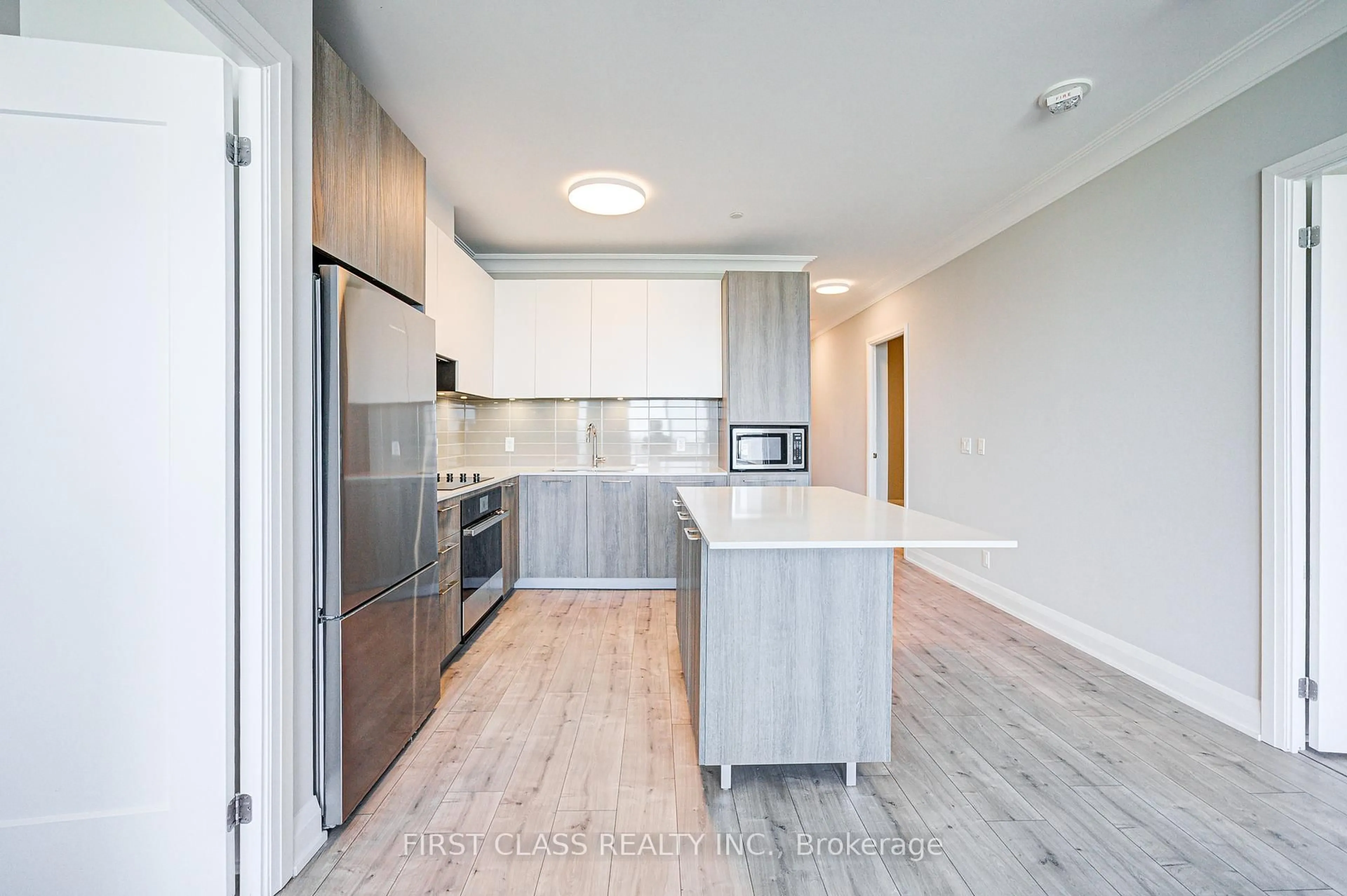 Open concept kitchen, wood/laminate floor for 18 Water Walk Dr #3106, Markham Ontario L3R 6L5