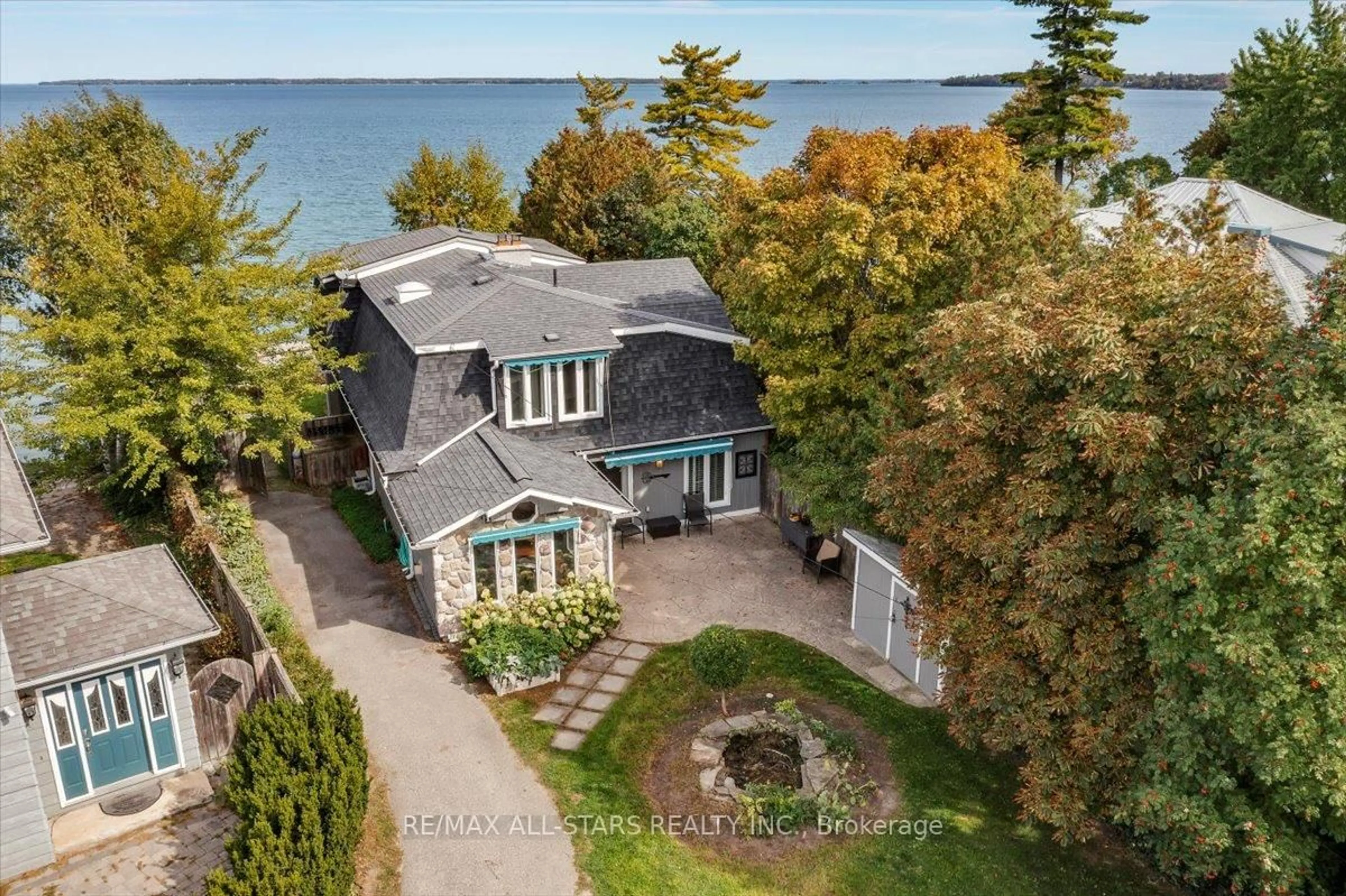 A pic from outside/outdoor area/front of a property/back of a property/a pic from drone, water/lake/river/ocean view for 1 Cedarhurst Park, Georgina Ontario L0E 1L0