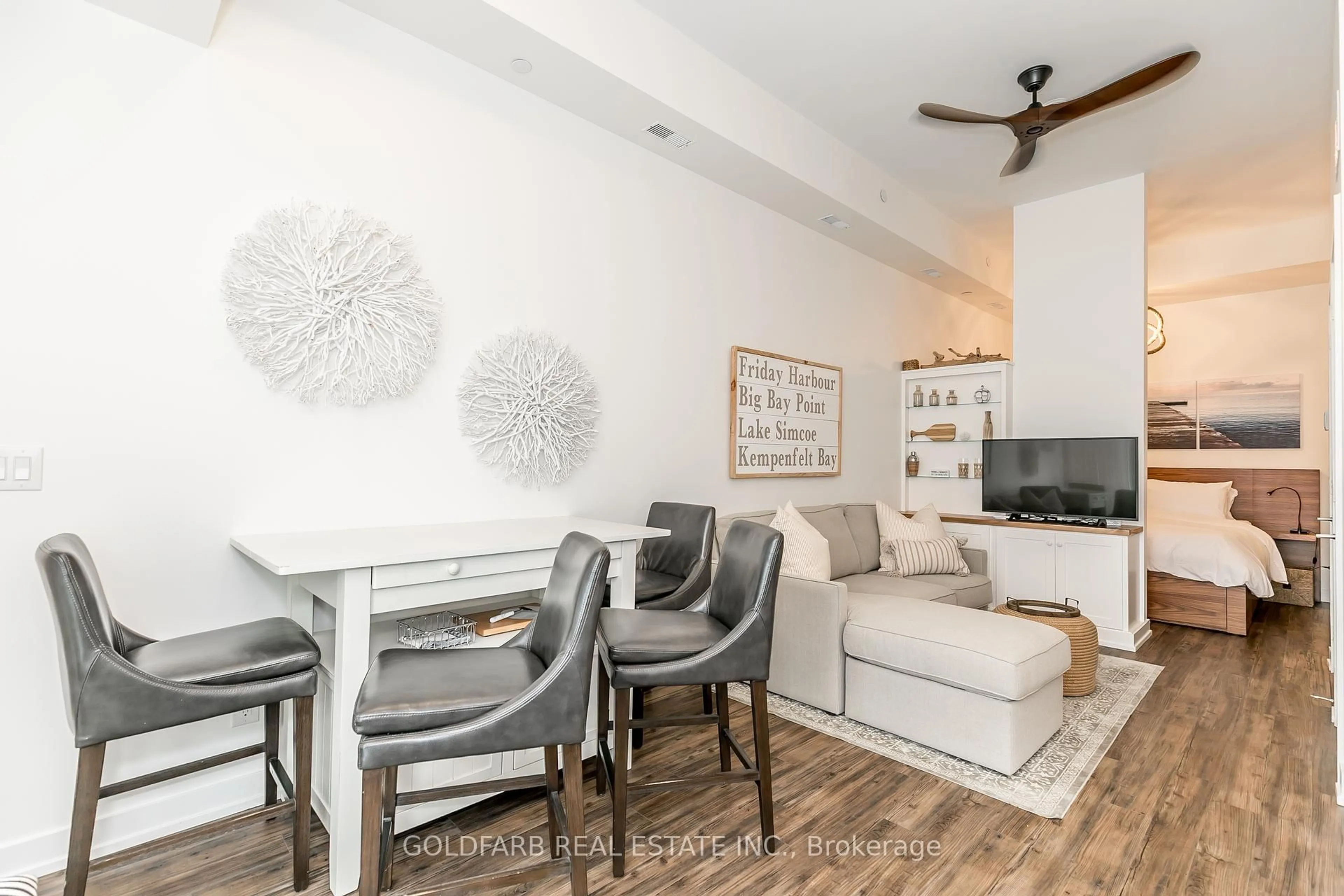 Living room with furniture, wood/laminate floor for 261 Broward Way #42, Innisfil Ontario L9S 0J5