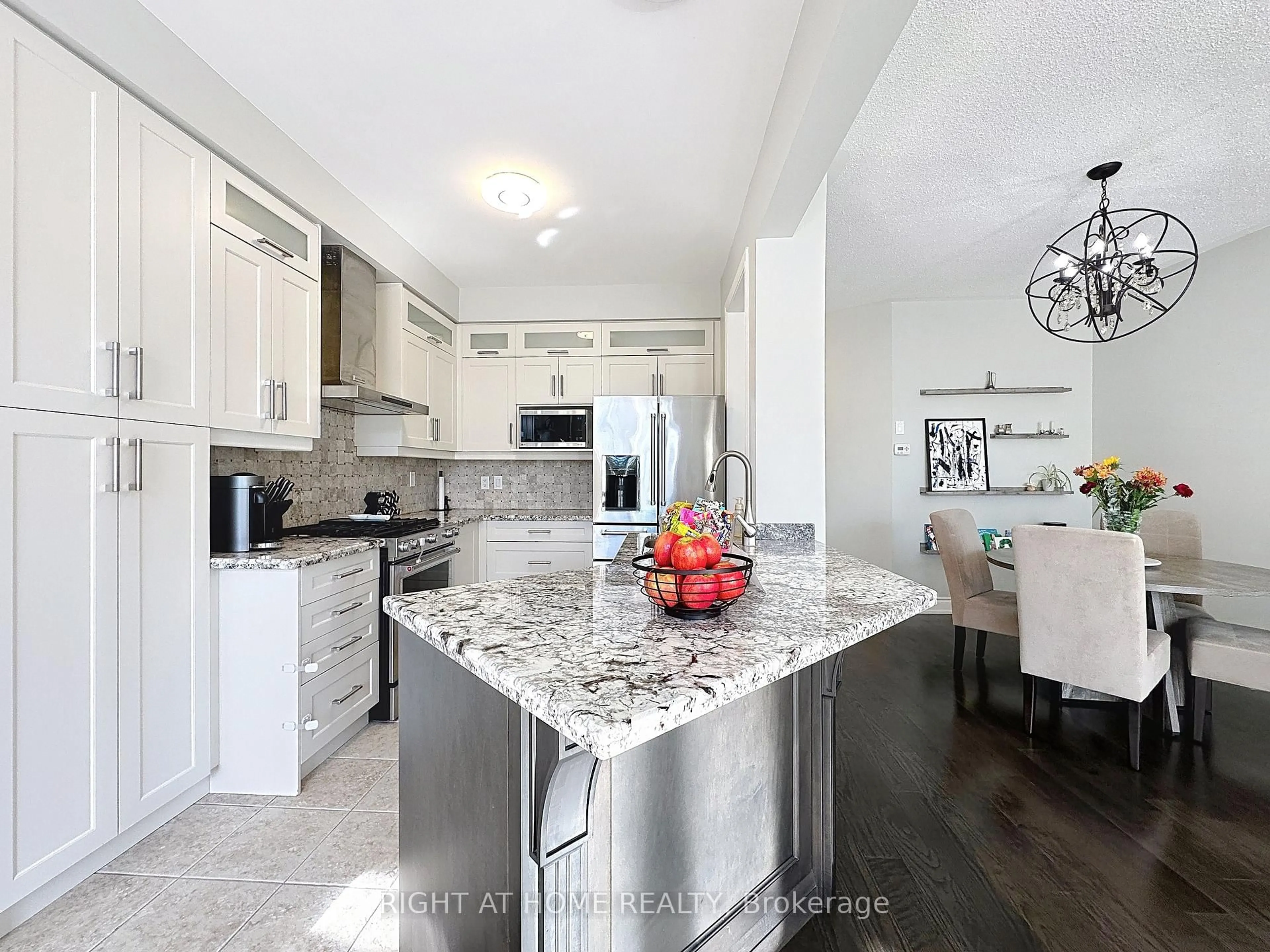 Open concept kitchen, ceramic/tile floor for 77 Gauguin Ave, Vaughan Ontario L4J 9J4