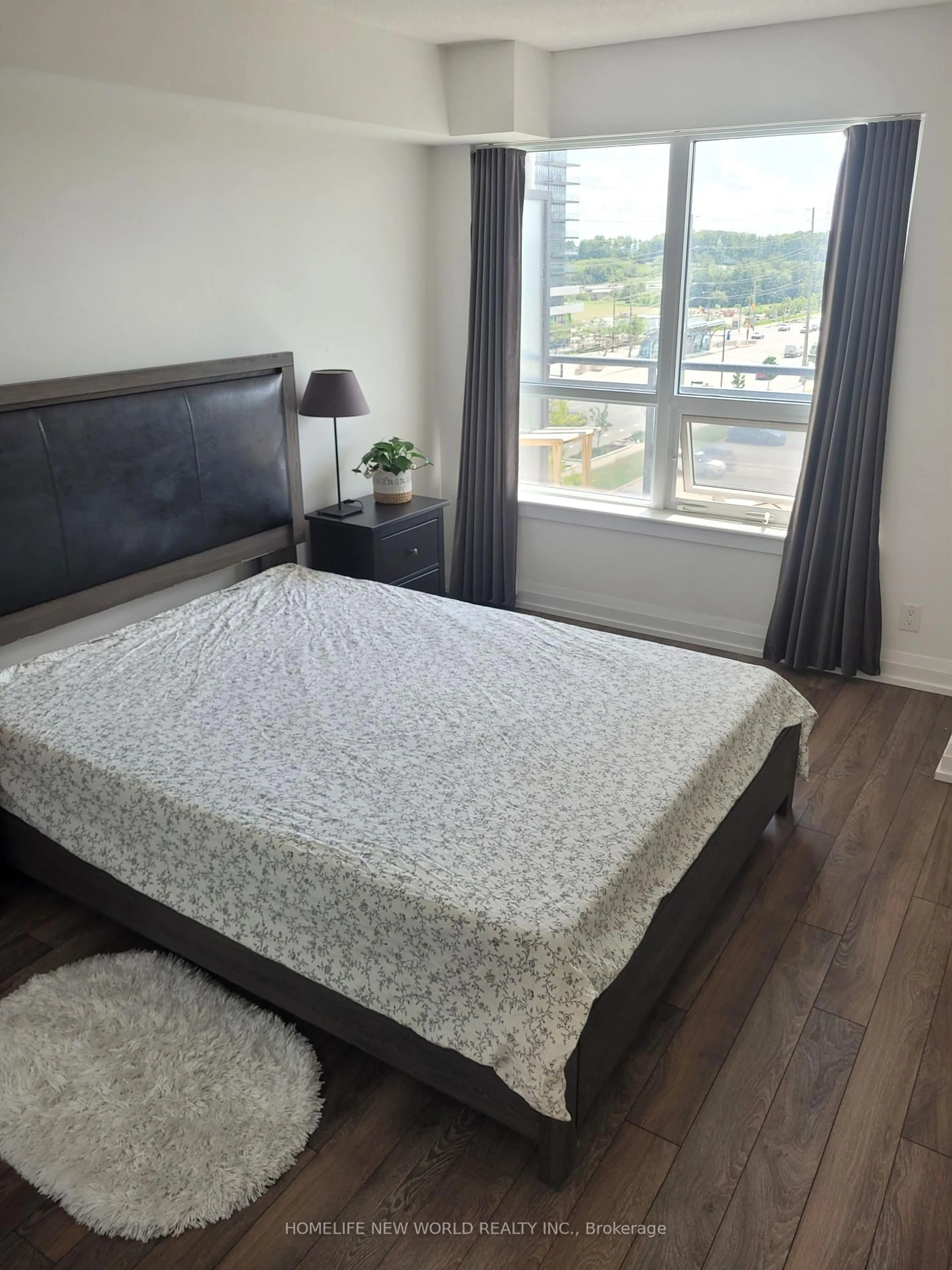 Bedroom with bed, wood/laminate floor for 370 Highway 7 Rd #717, Richmond Hill Ontario L4B 0C4