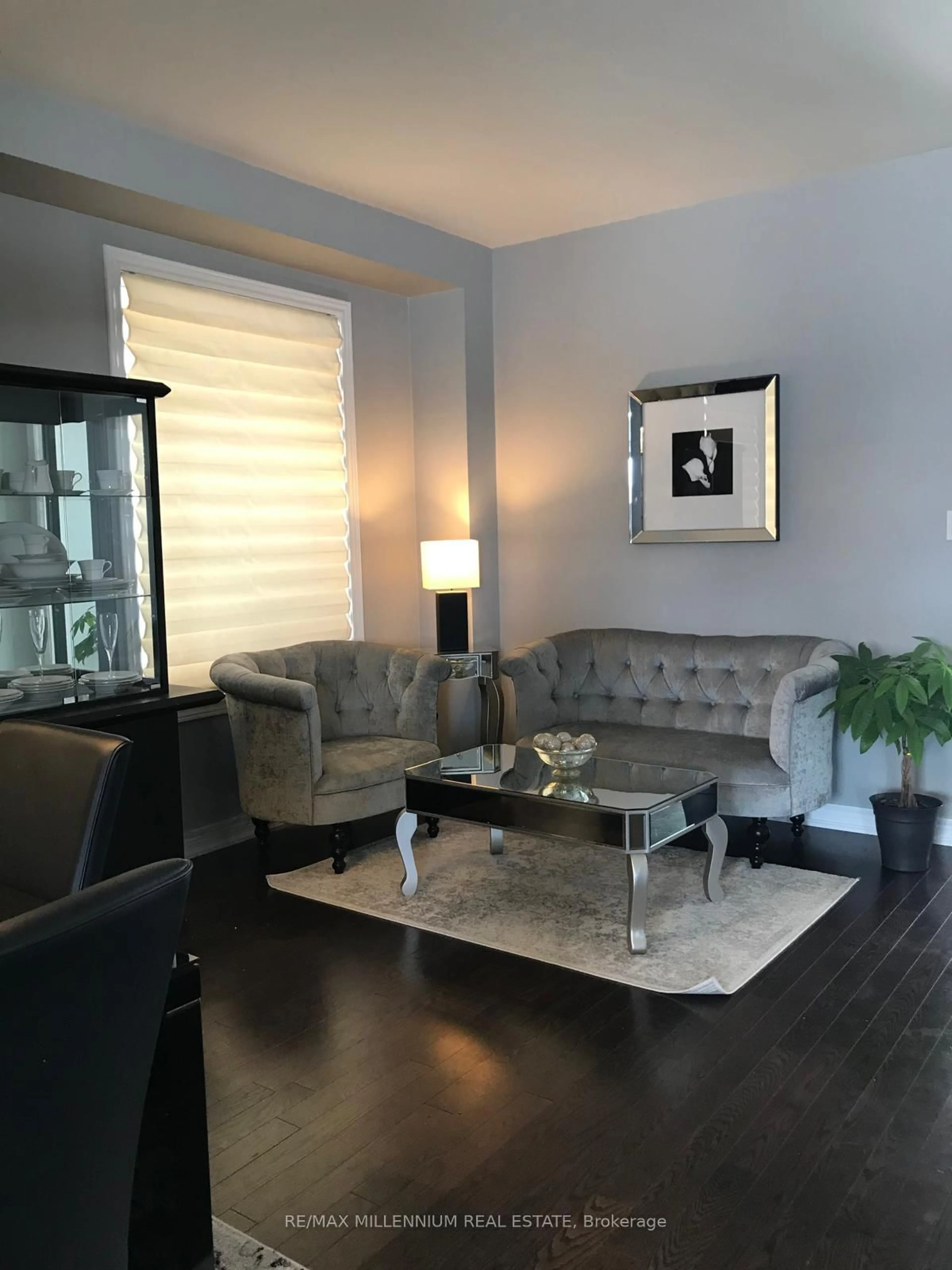 Living room with furniture, wood/laminate floor for 82 Lampkin St #89/BARNETT, Georgina Ontario L0E 1R0