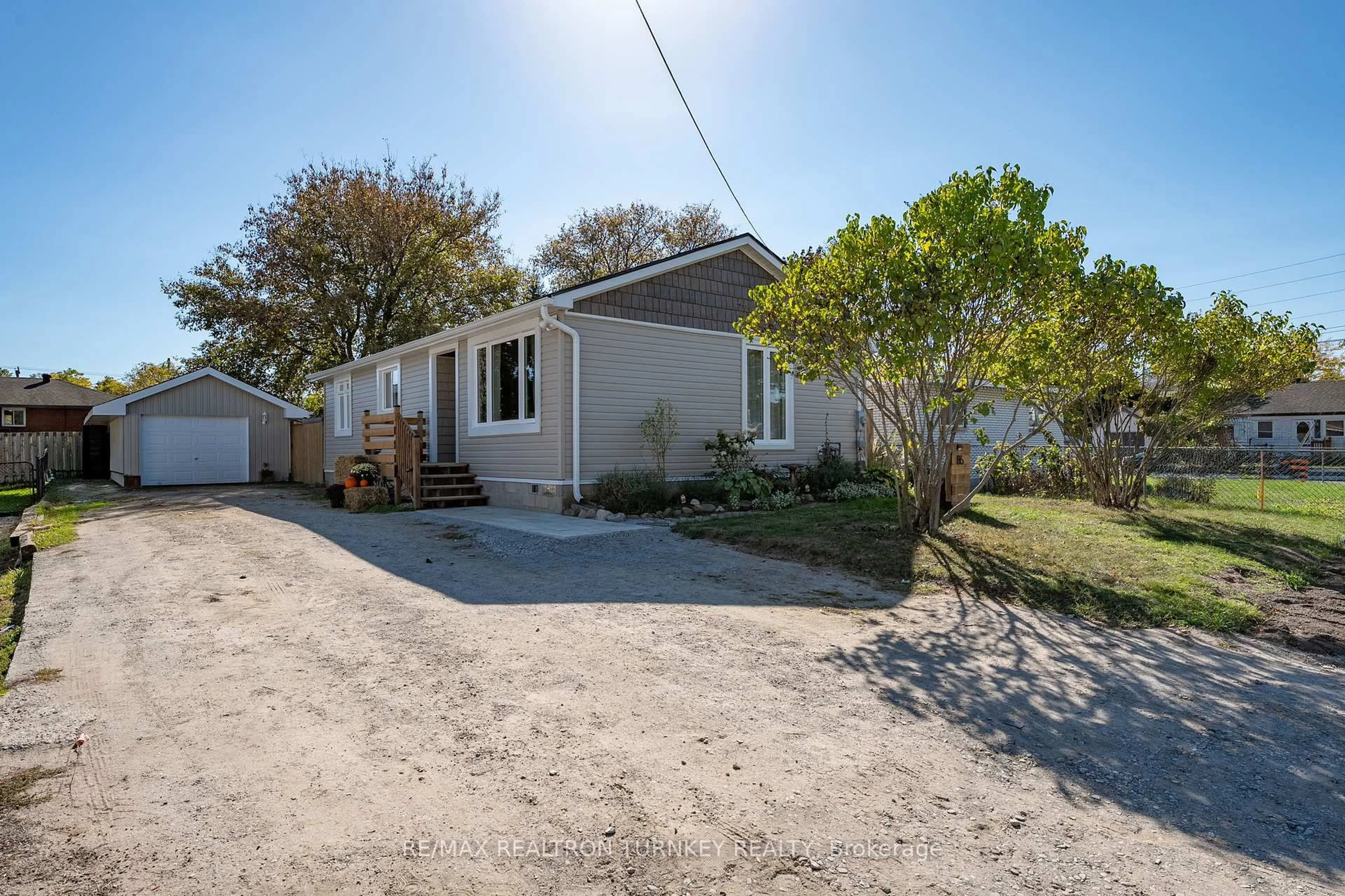 A pic from outside/outdoor area/front of a property/back of a property/a pic from drone, street for 86 Simcoe St, Essa Ontario L0M 1B0