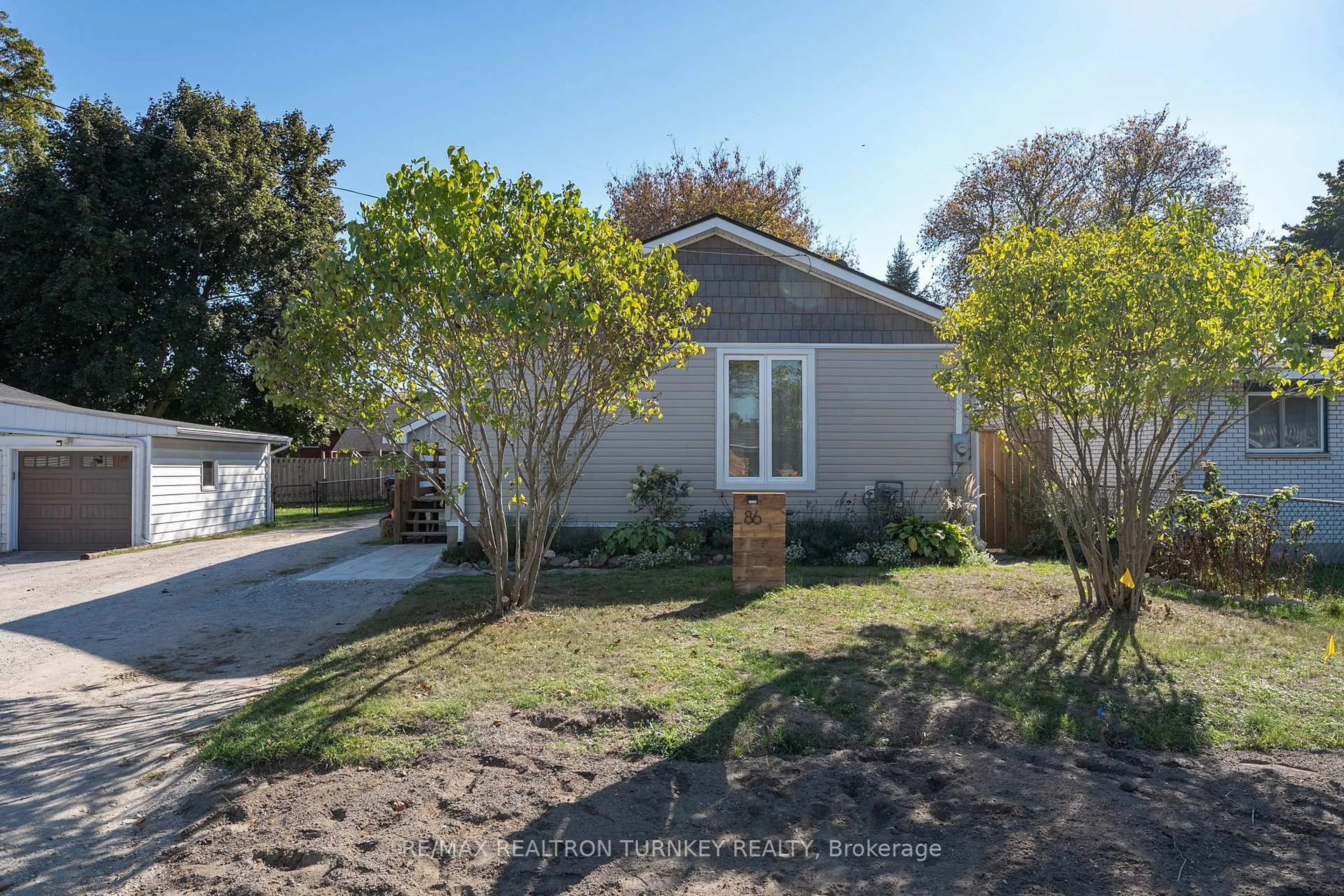 A pic from outside/outdoor area/front of a property/back of a property/a pic from drone, street for 86 Simcoe St, Essa Ontario L0M 1B0