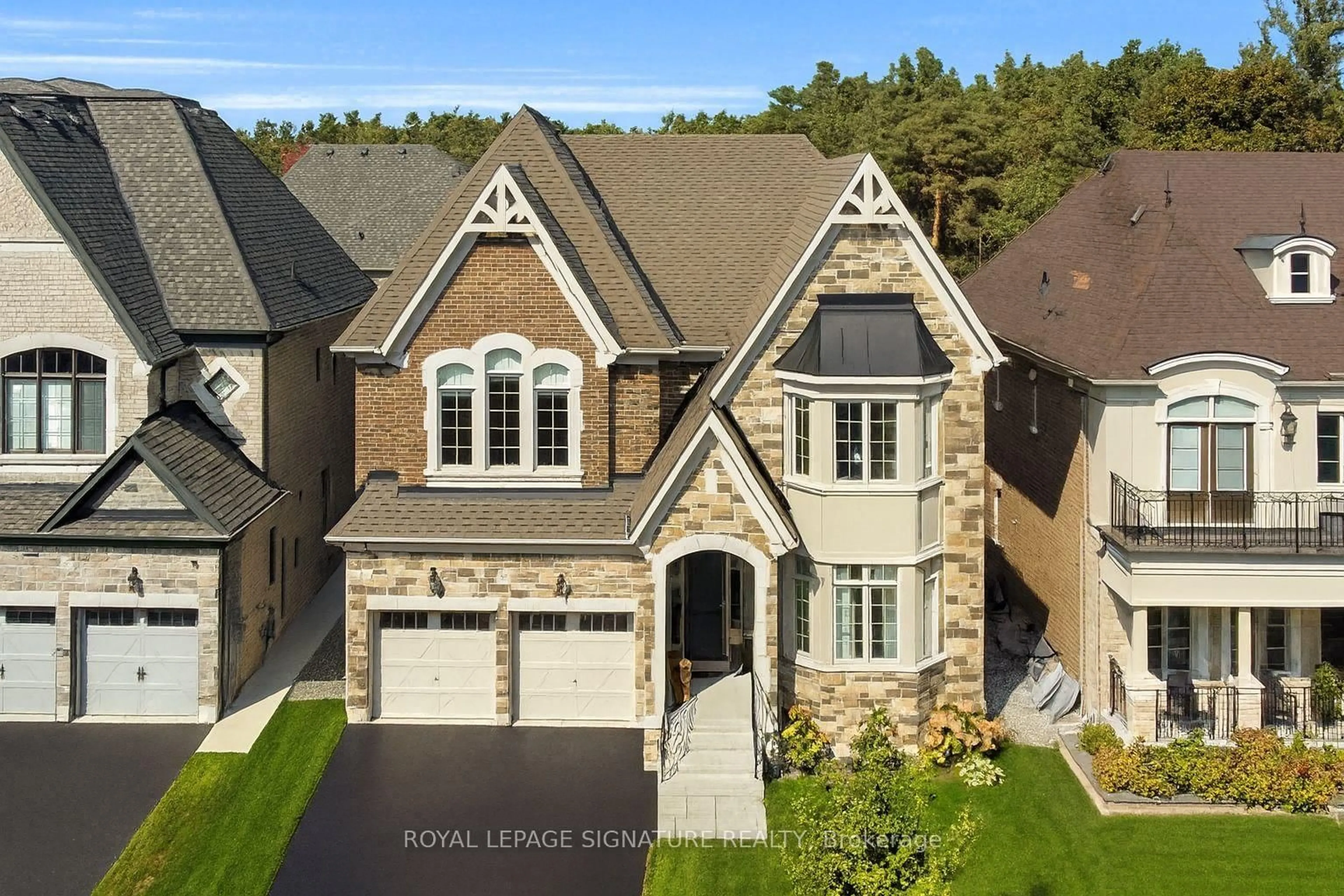 Home with brick exterior material, street for 55 Glensteeple Tr, Aurora Ontario L4G 3T1