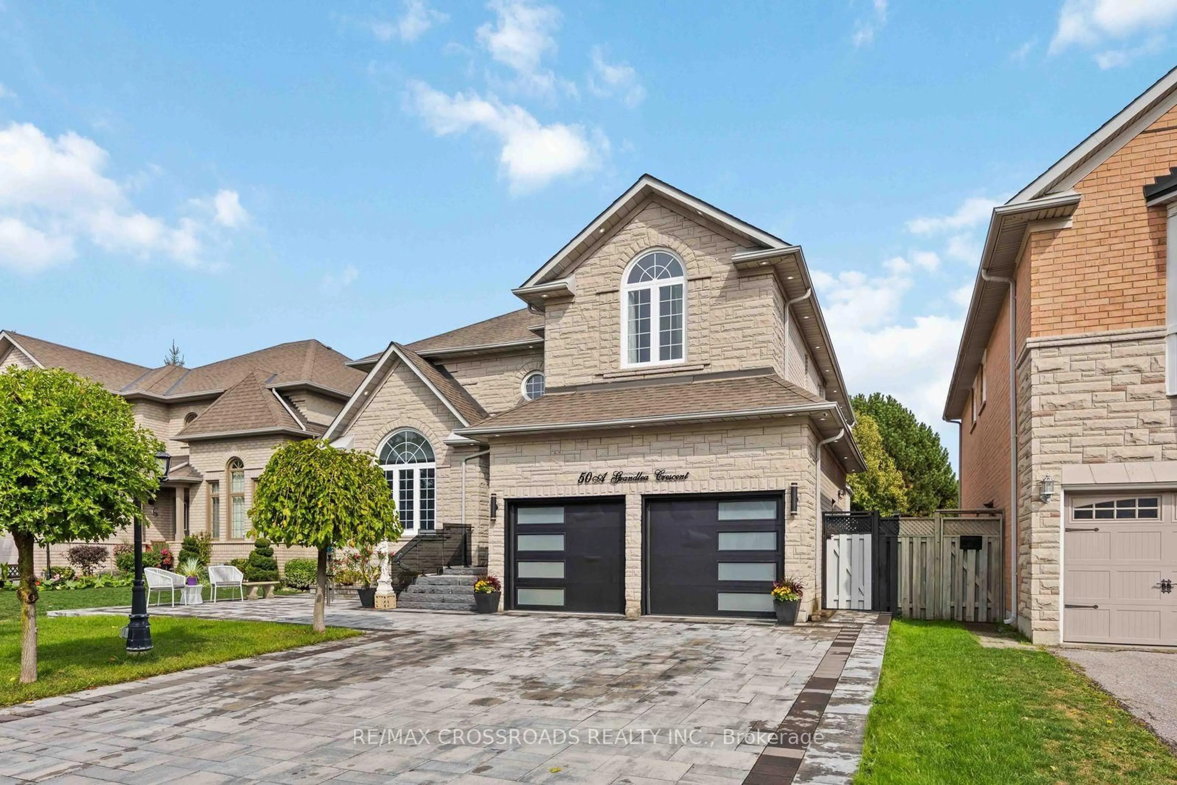 Home with brick exterior material, street for 50 Grandlea Cres, Markham Ontario L3S 4A2