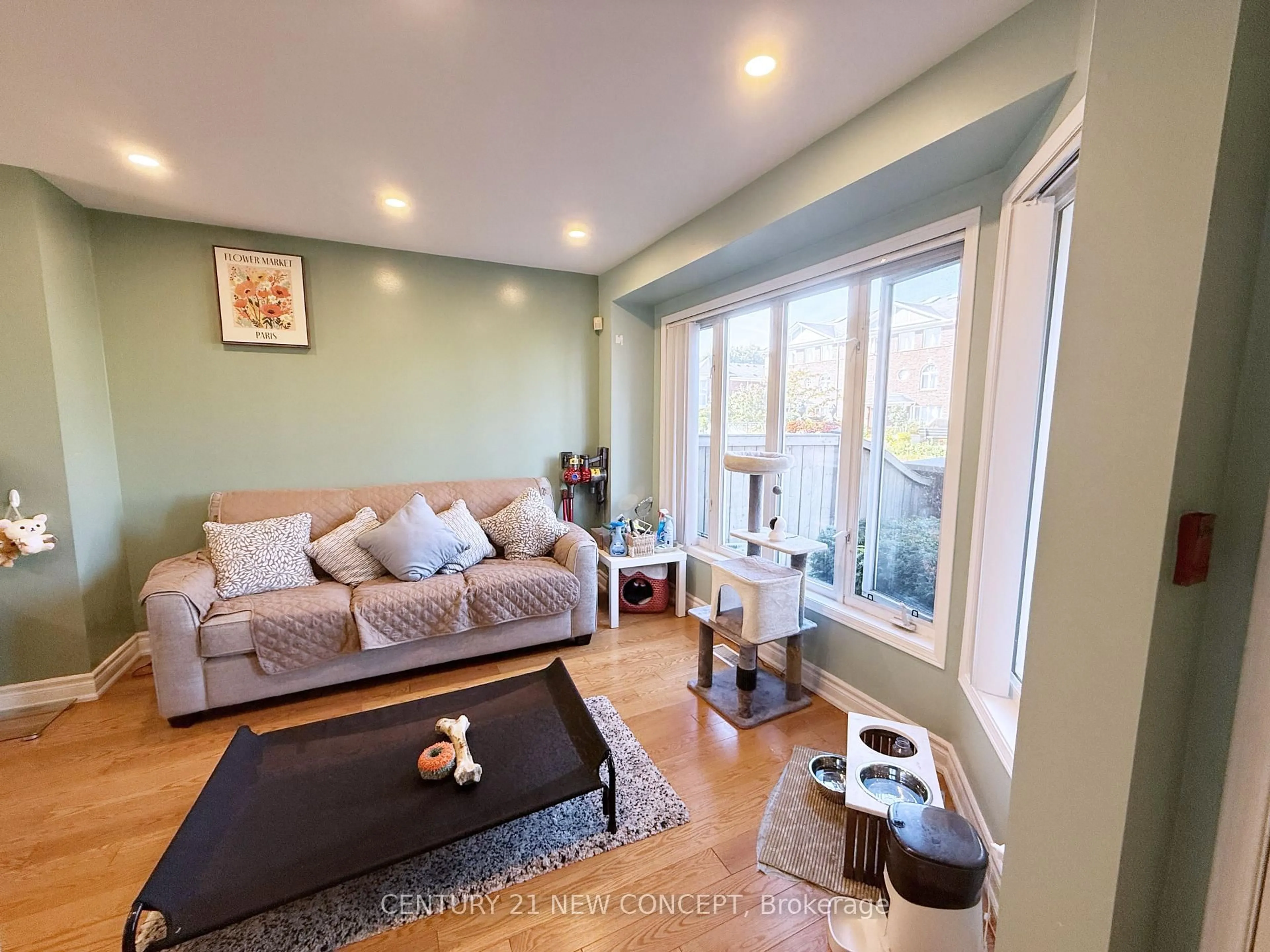Living room with furniture, wood/laminate floor for 18 Clark Ave #107, Vaughan Ontario L4J 8H1