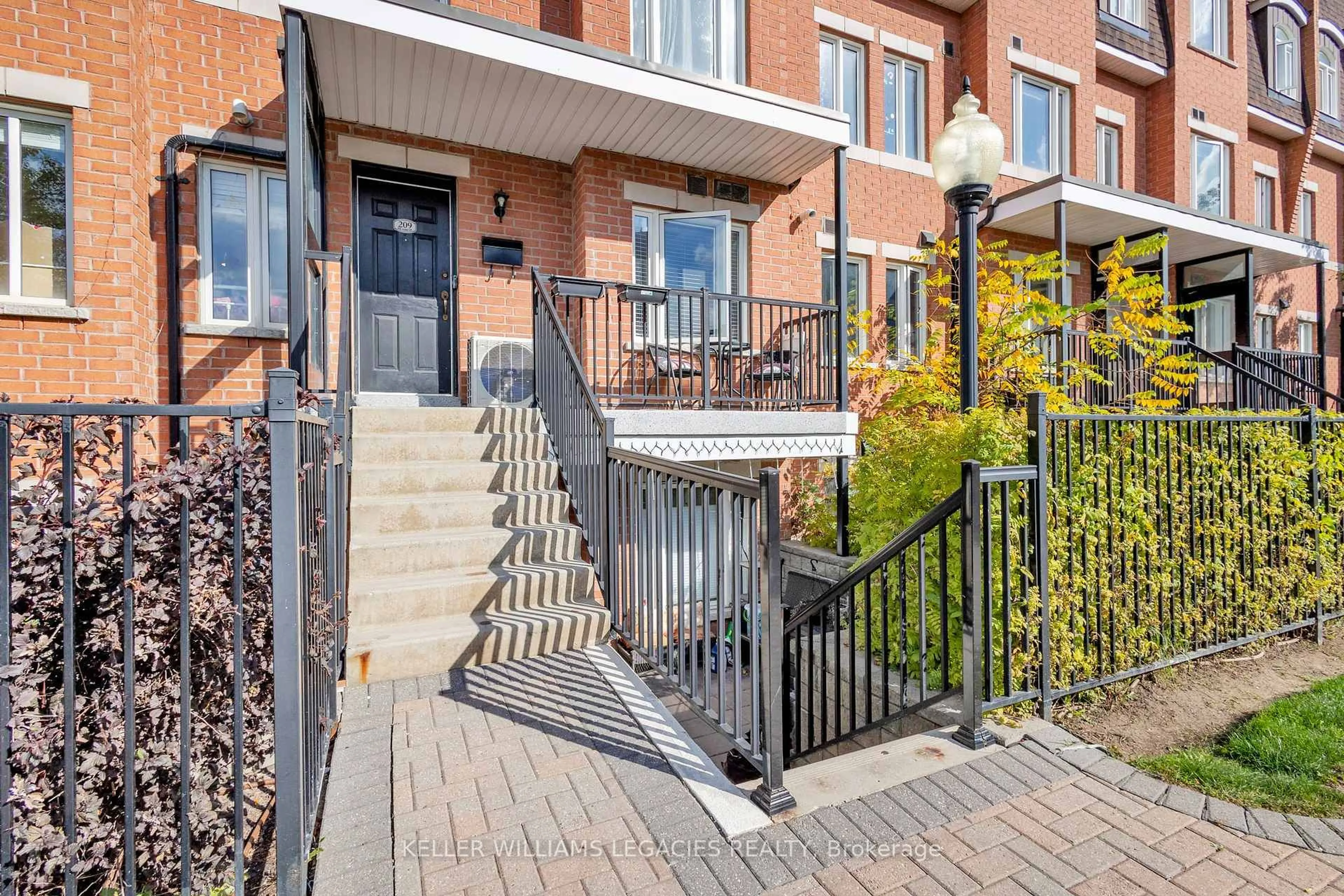 Home with brick exterior material, street for 308 John St #209, Markham Ontario L3T 0A7