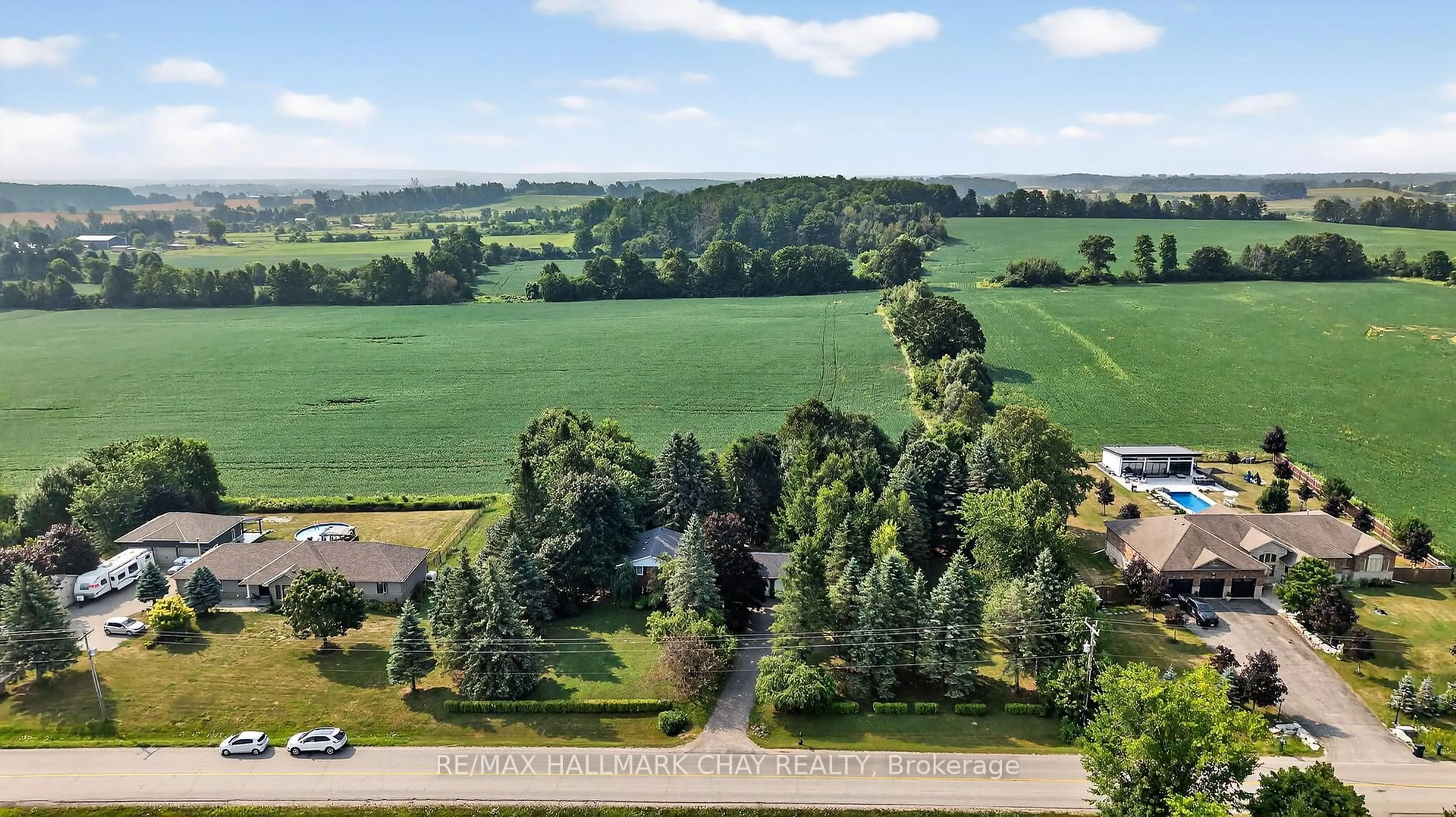 A pic from outside/outdoor area/front of a property/back of a property/a pic from drone, forest/trees view for 5205 5th Line, New Tecumseth Ontario L0G 1W0