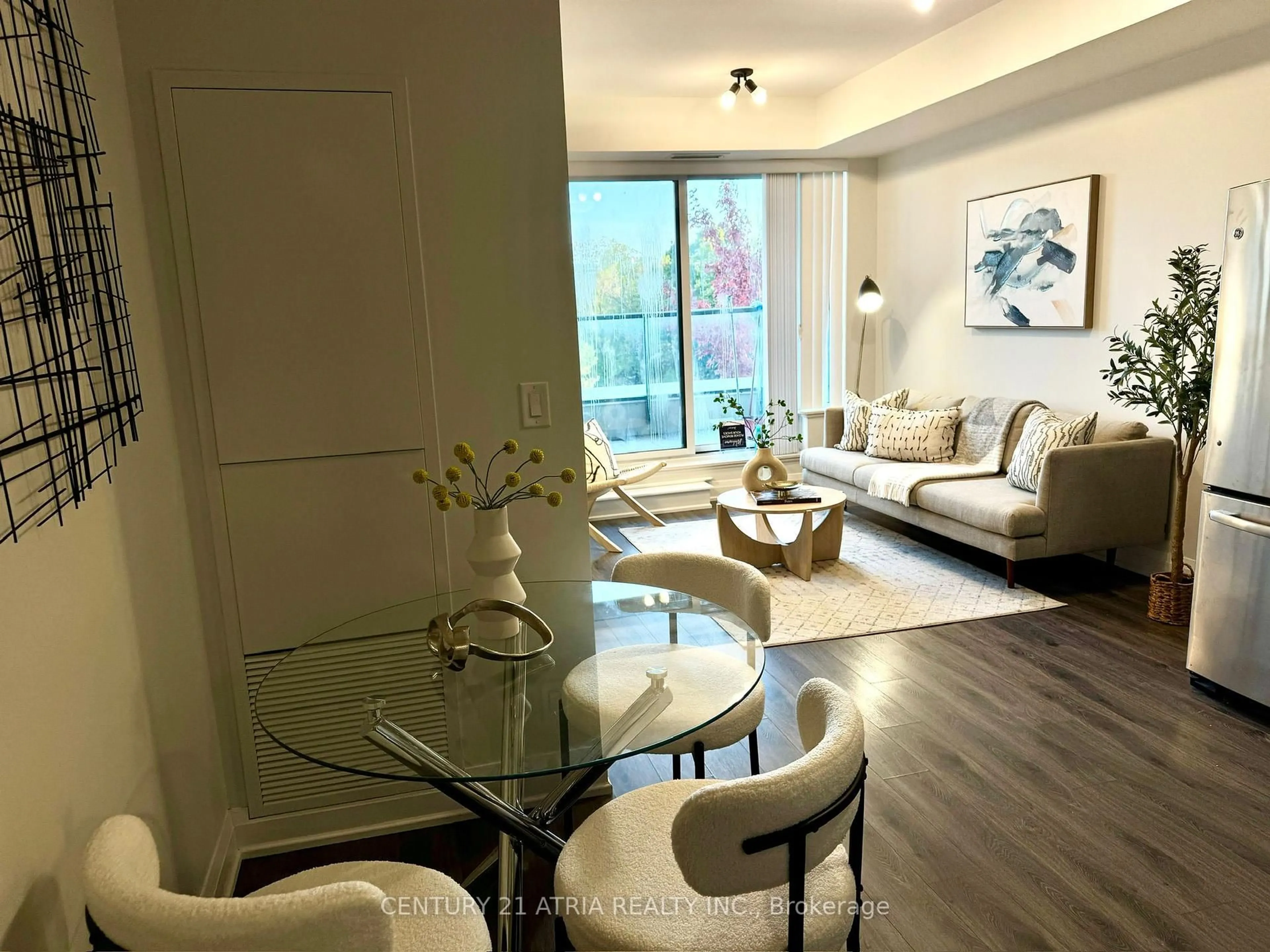 Living room with furniture, wood/laminate floor for 18 Uptown Dr #321, Markham Ontario L3R 5M5
