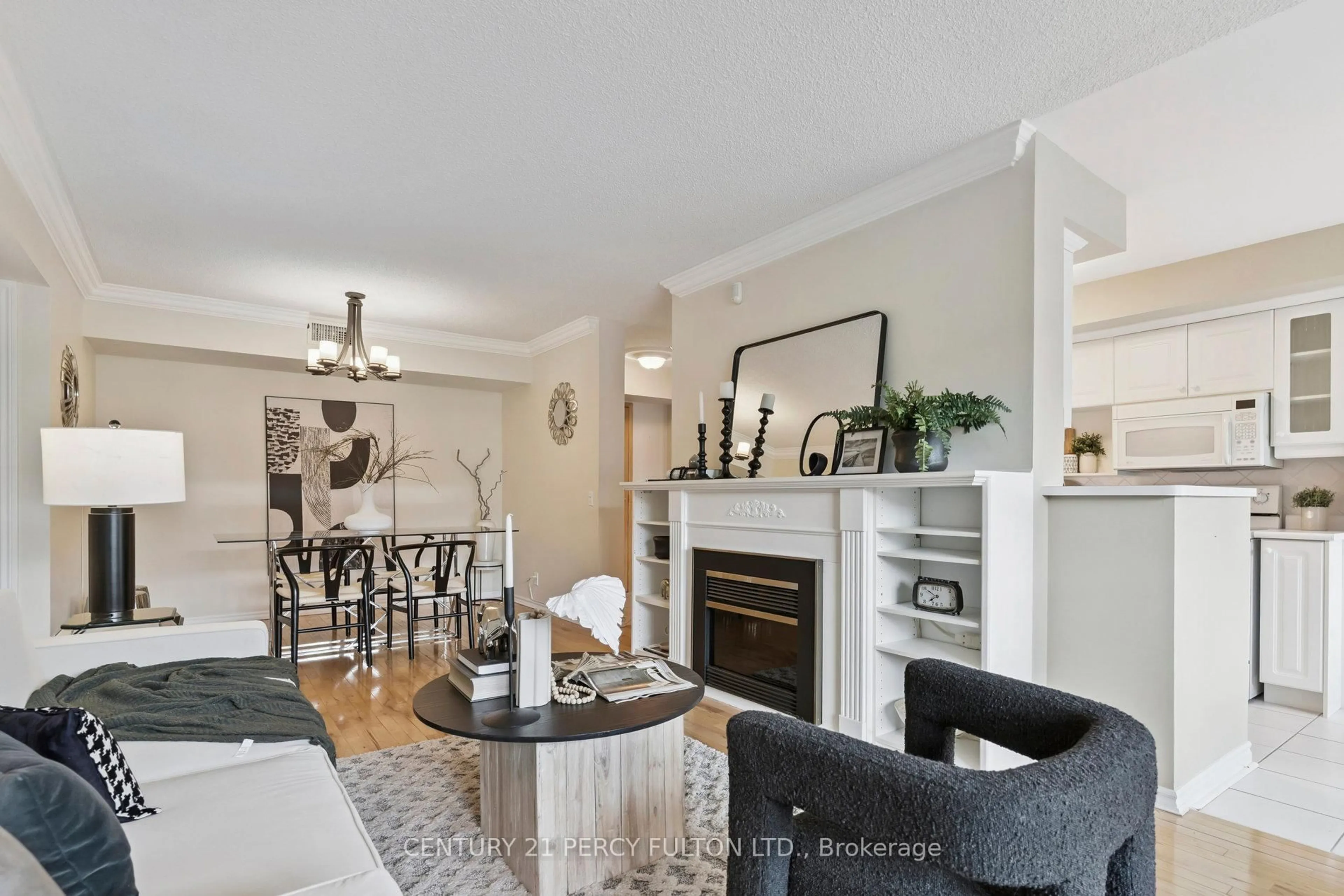 Living room with furniture, wood/laminate floor for 55 The Boardwalk Way #309, Markham Ontario L6E 1B7