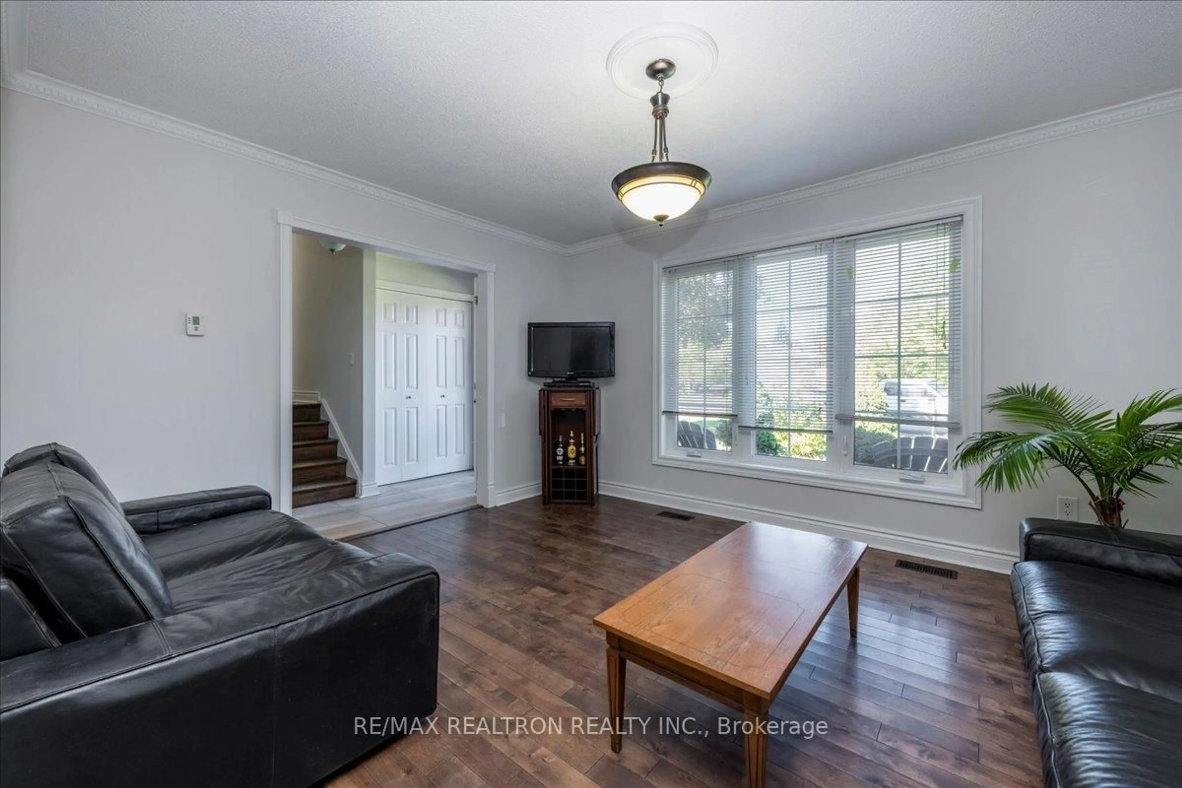 Living room with furniture, wood/laminate floor for 11 Burbank Circ, Adjala-Tosorontio Ontario L0M 1J0