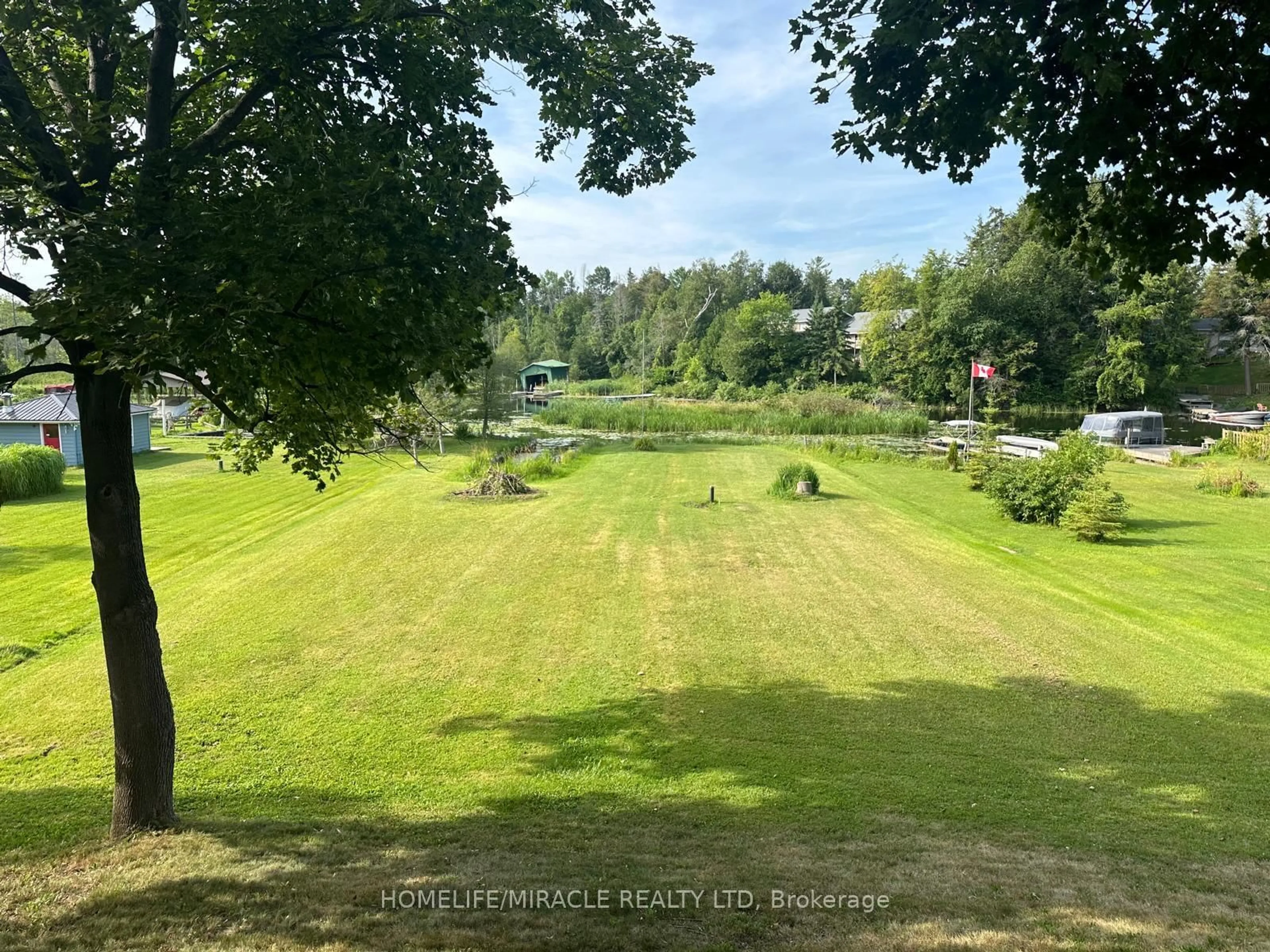 A pic from outside/outdoor area/front of a property/back of a property/a pic from drone, water/lake/river/ocean view for 164 RIVERBANK Dr, Georgina Ontario L0E 1N0