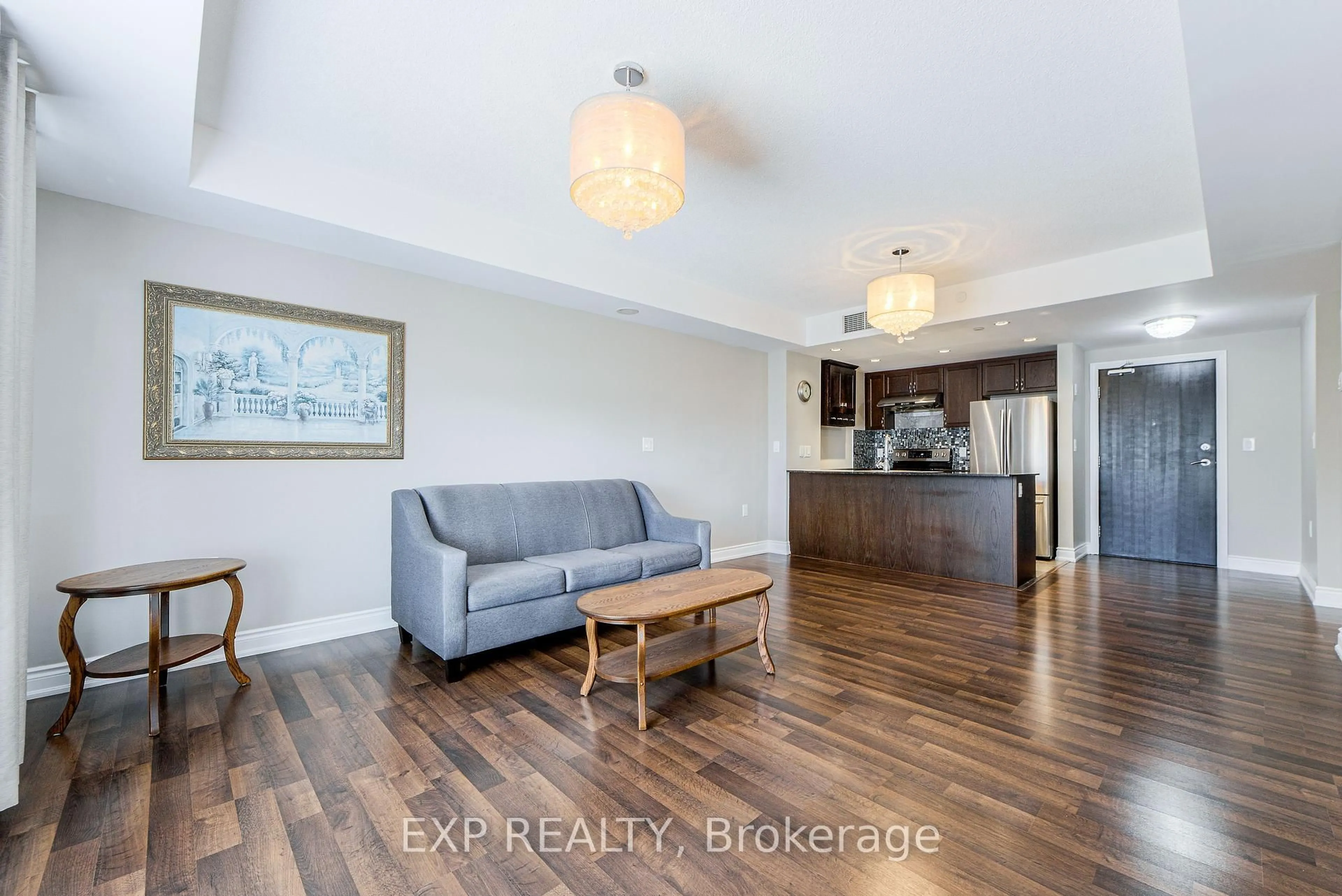 Living room with furniture, wood/laminate floor for 149 Church St #418, King Ontario L0G 1T0