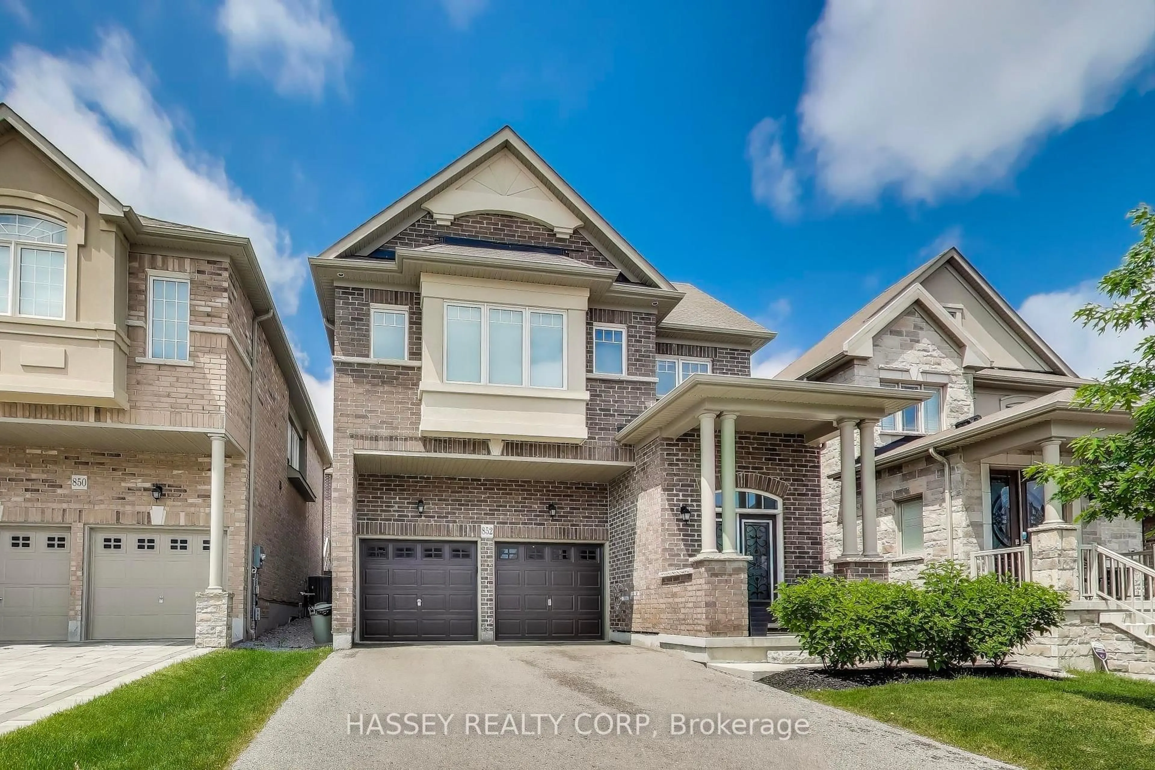 Home with brick exterior material, street for 852 Elvidge Tr, Newmarket Ontario L3X 0J7