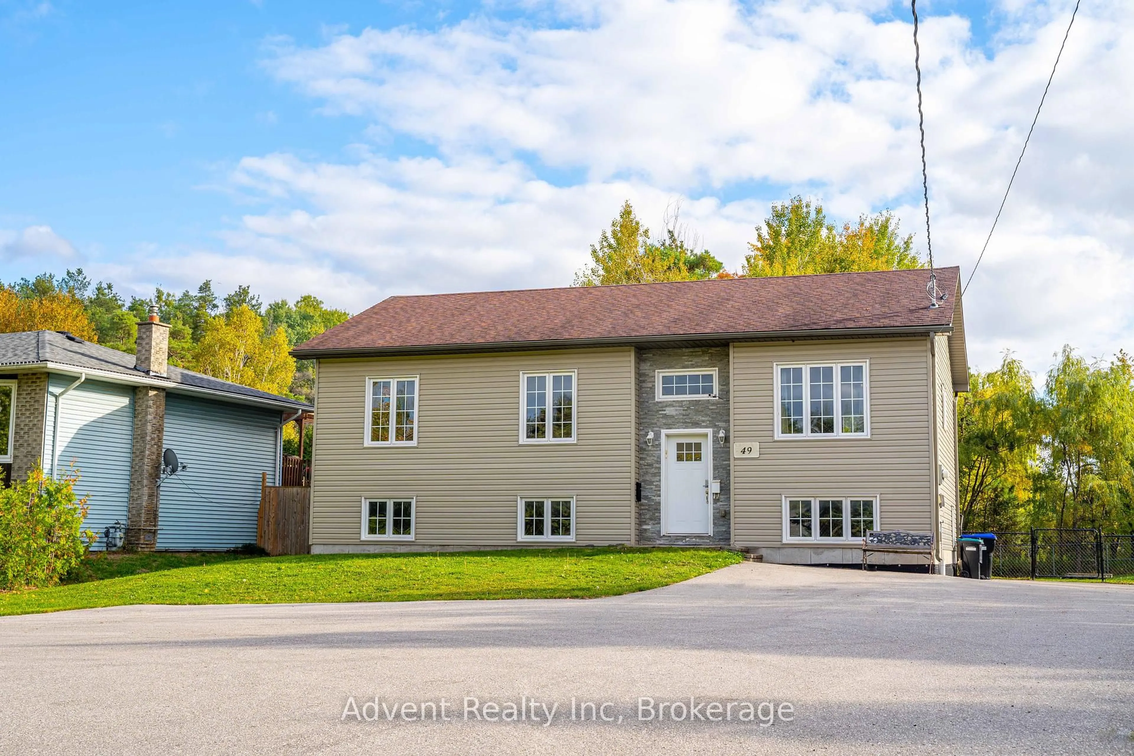 Home with vinyl exterior material, street for 49 Brentwood Rd, Essa Ontario L0M 1B2