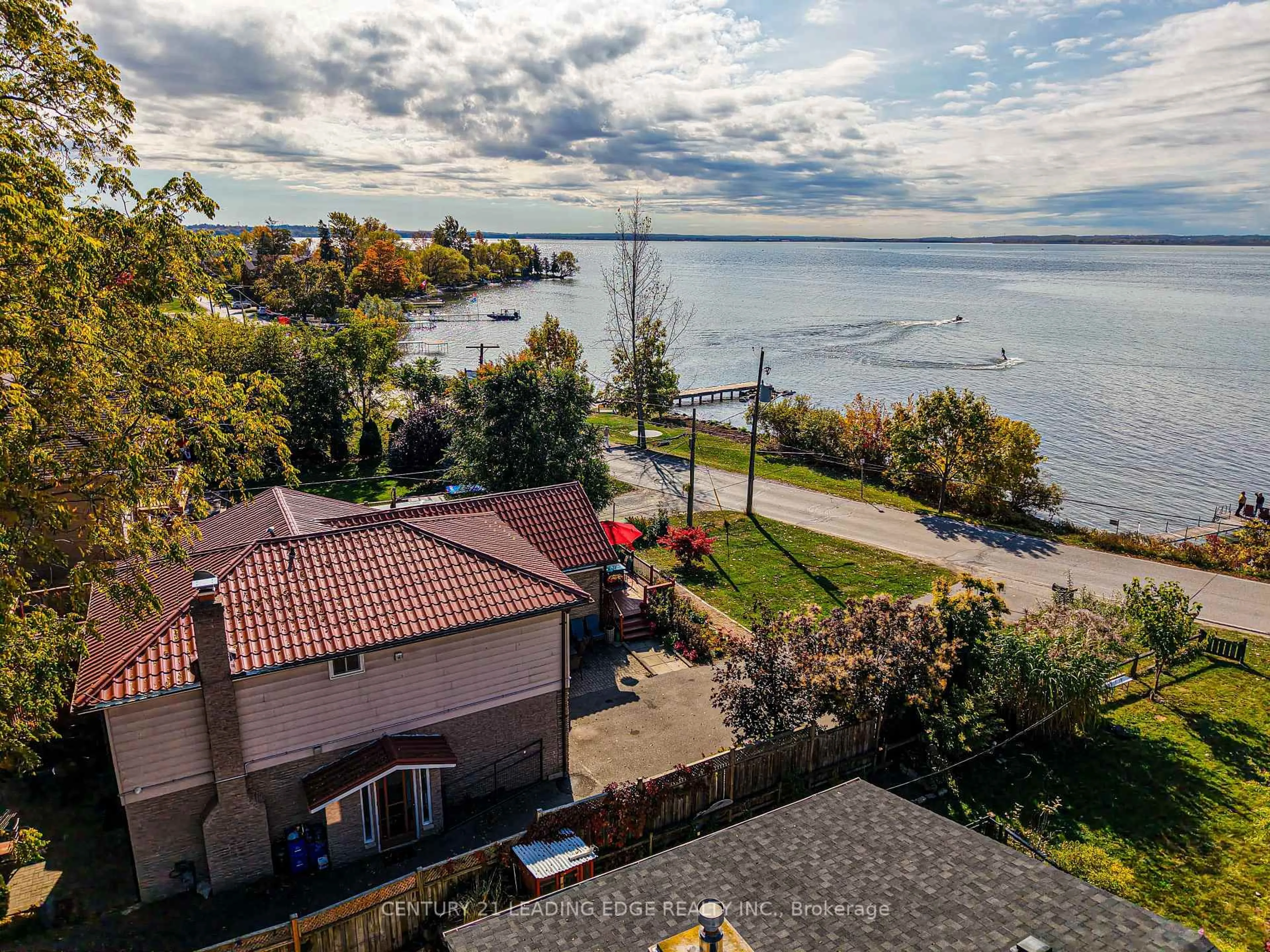 A pic from outside/outdoor area/front of a property/back of a property/a pic from drone, water/lake/river/ocean view for 55 Lake Dr, Georgina Ontario L4P 1A5