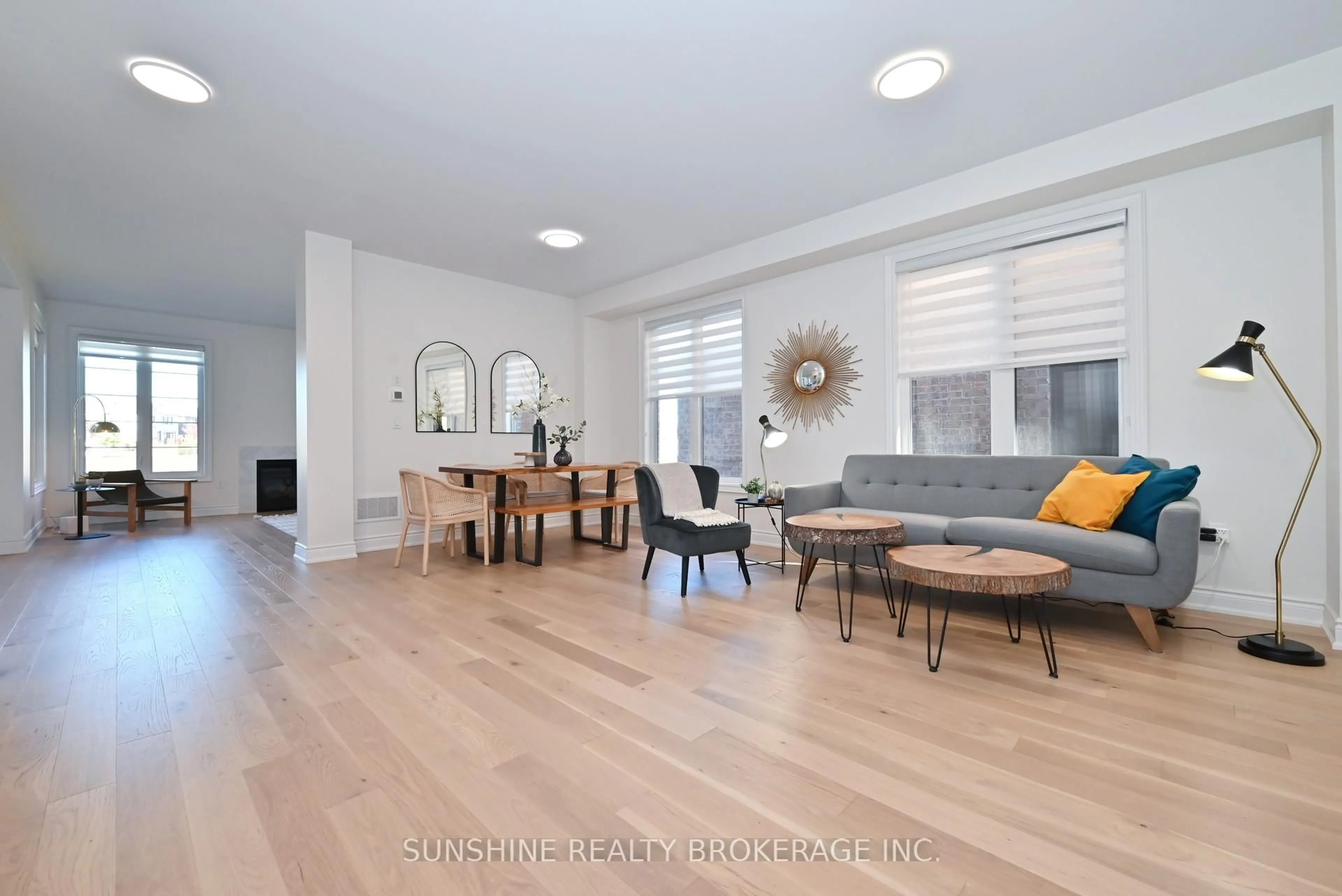 Living room with furniture, wood/laminate floor for 12 Meadow Vista Cres, East Gwillimbury Ontario L9N 0T4