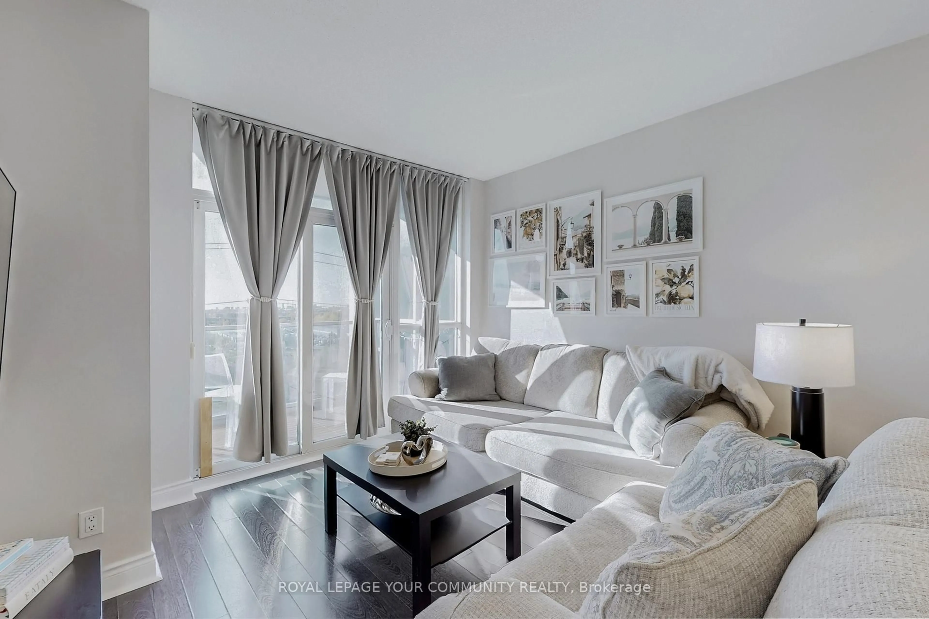 Living room with furniture, wood/laminate floor for 23 Cox Blvd #962, Markham Ontario L3R 4G1