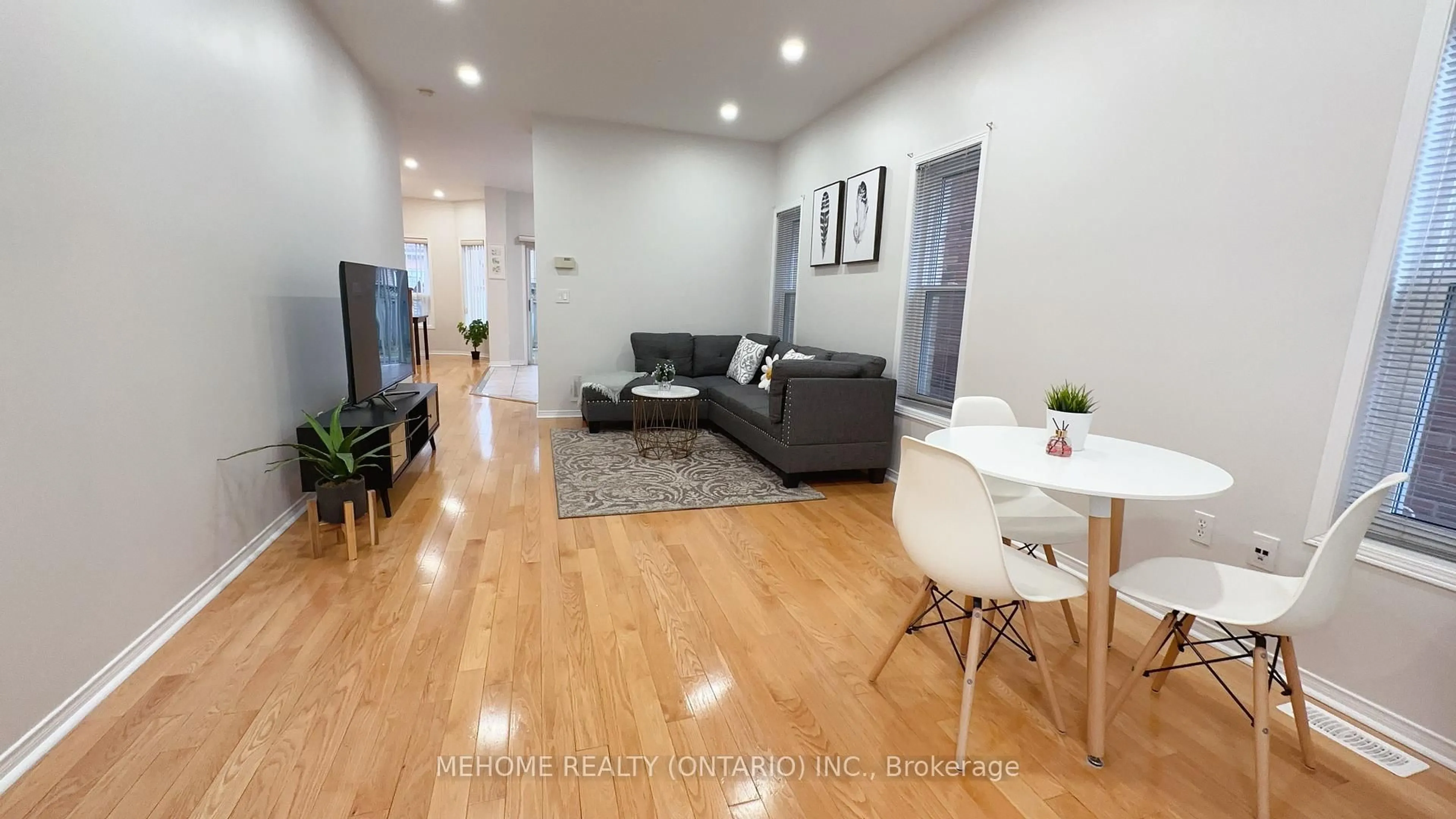 Living room with furniture, wood/laminate floor for 15 Catherina St, Markham Ontario L6C 2L6