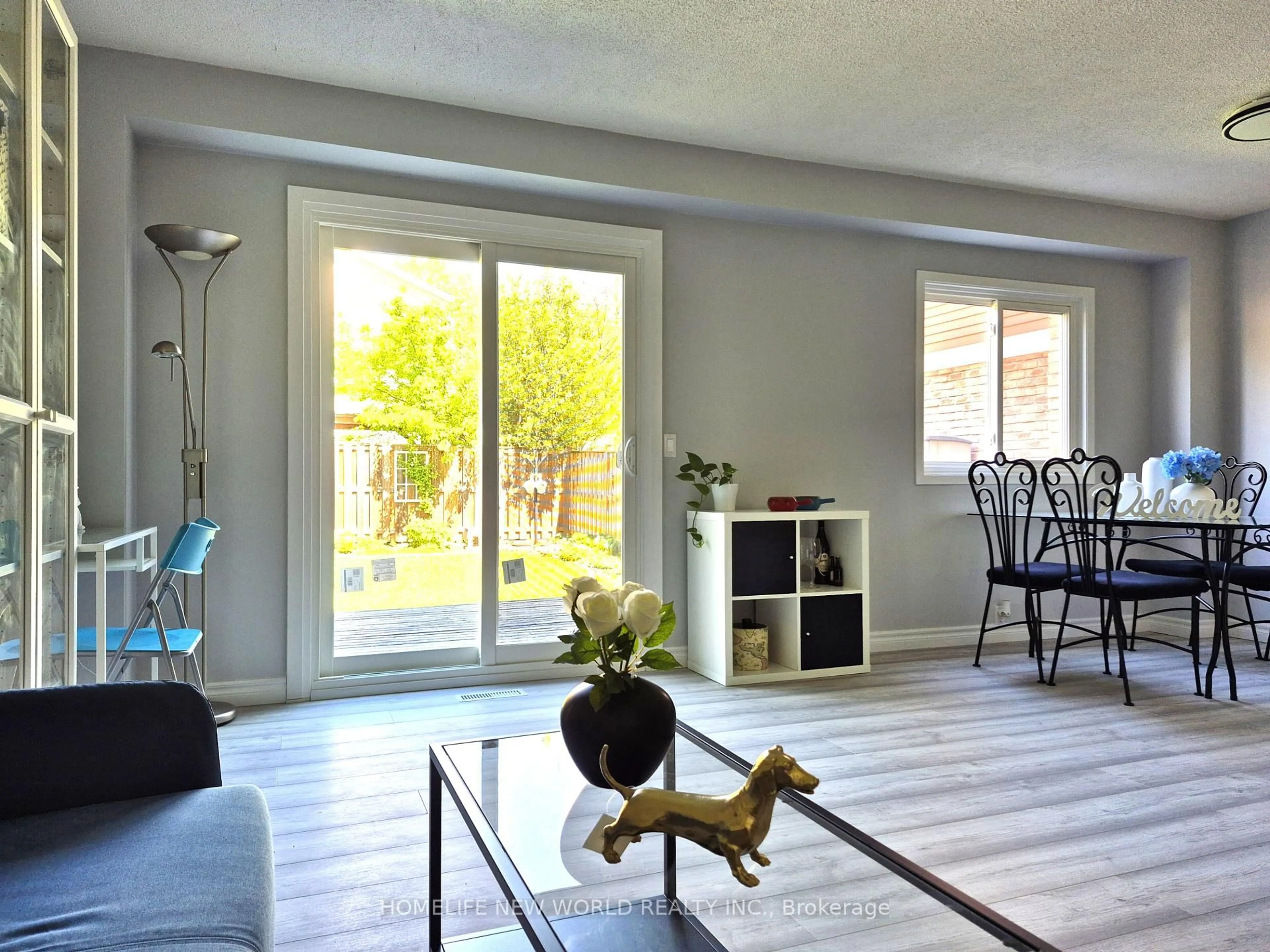 Living room with furniture, wood/laminate floor for 88 Madsen Cres, Markham Ontario L3R 4P3