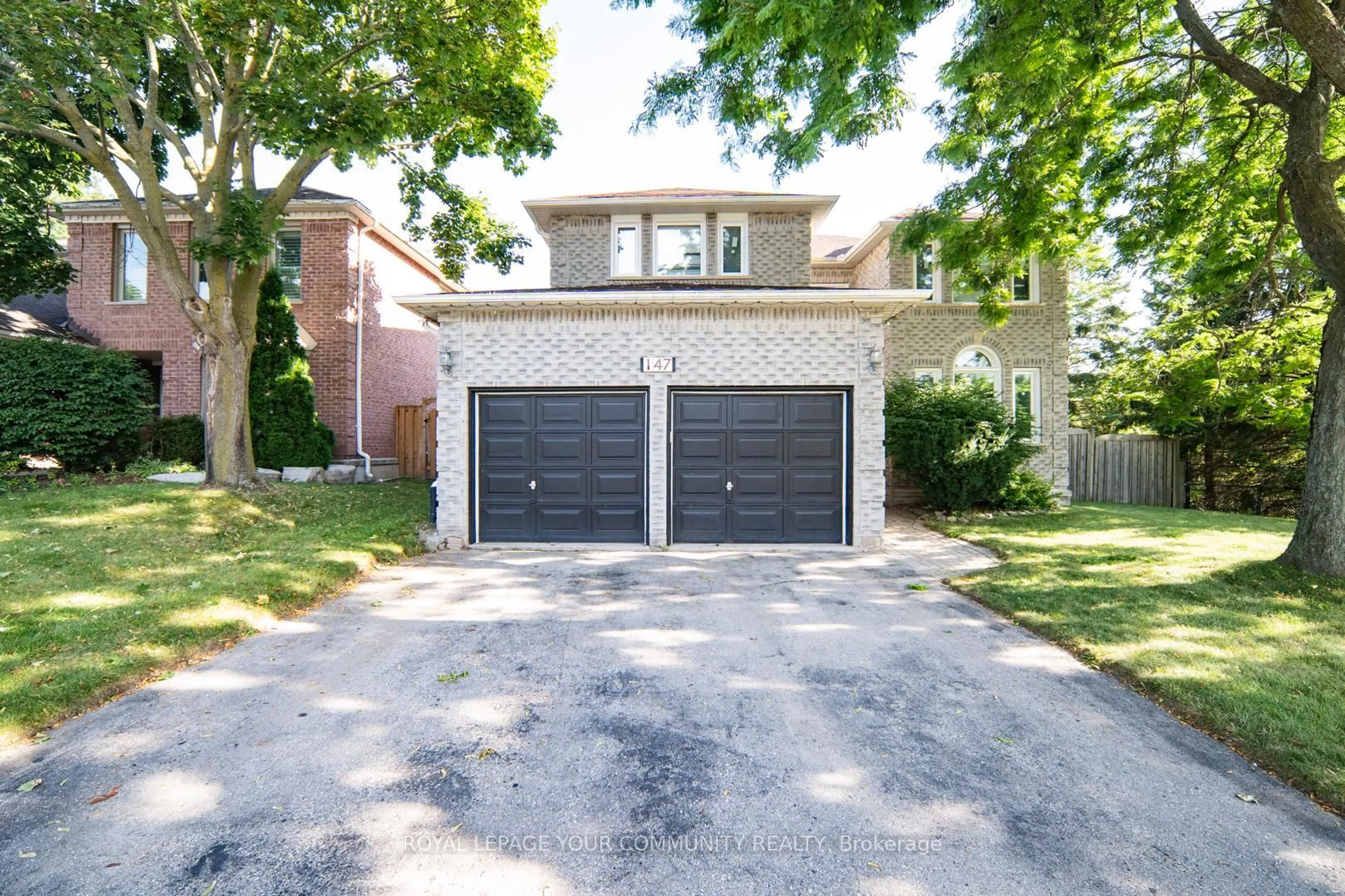 Home with brick exterior material, street for 147 John Button Blvd, Markham Ontario L3R 9G2