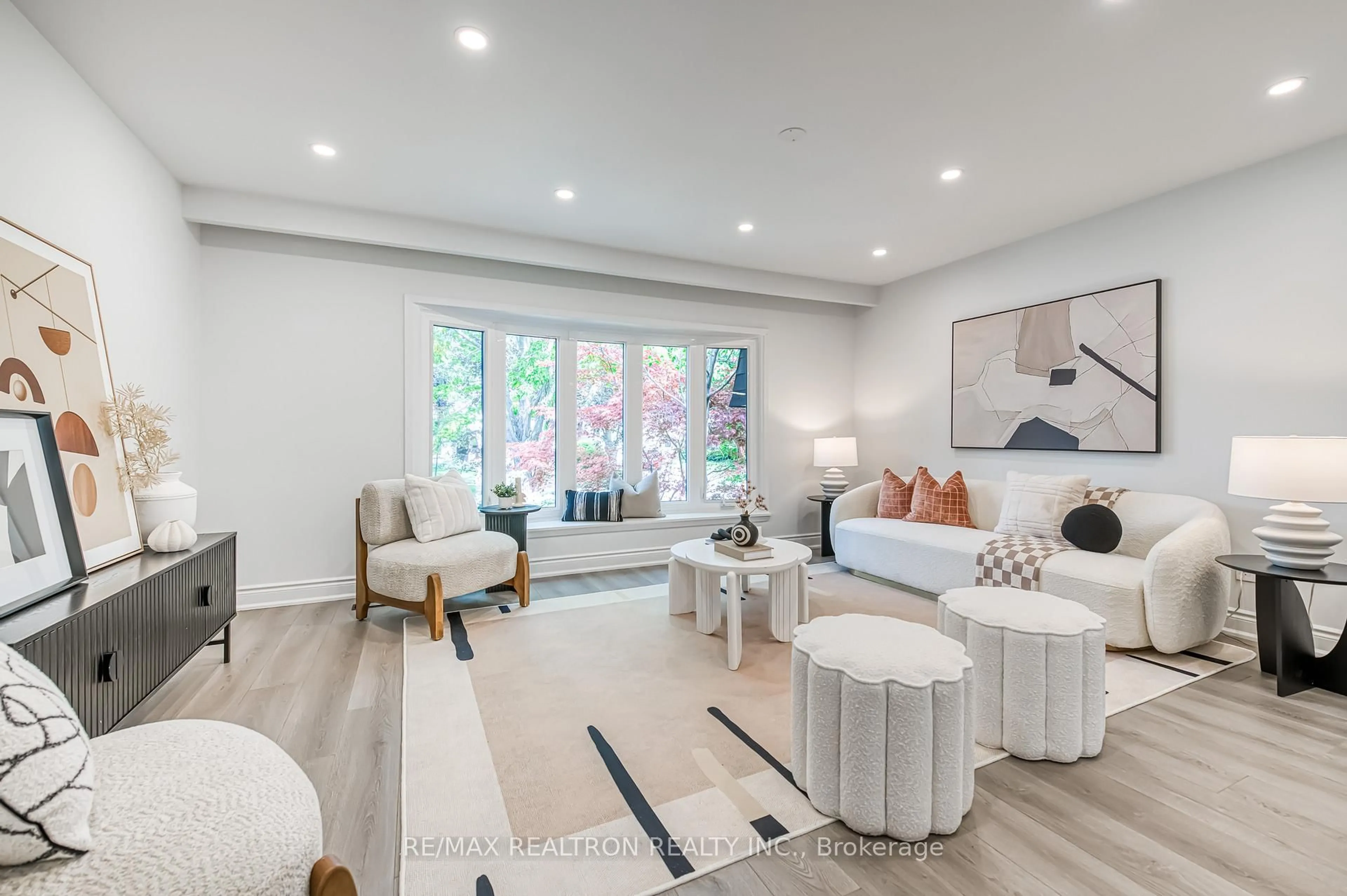 Living room with furniture, wood/laminate floor for 39 Ferrah St, Markham Ontario L3R 1N6