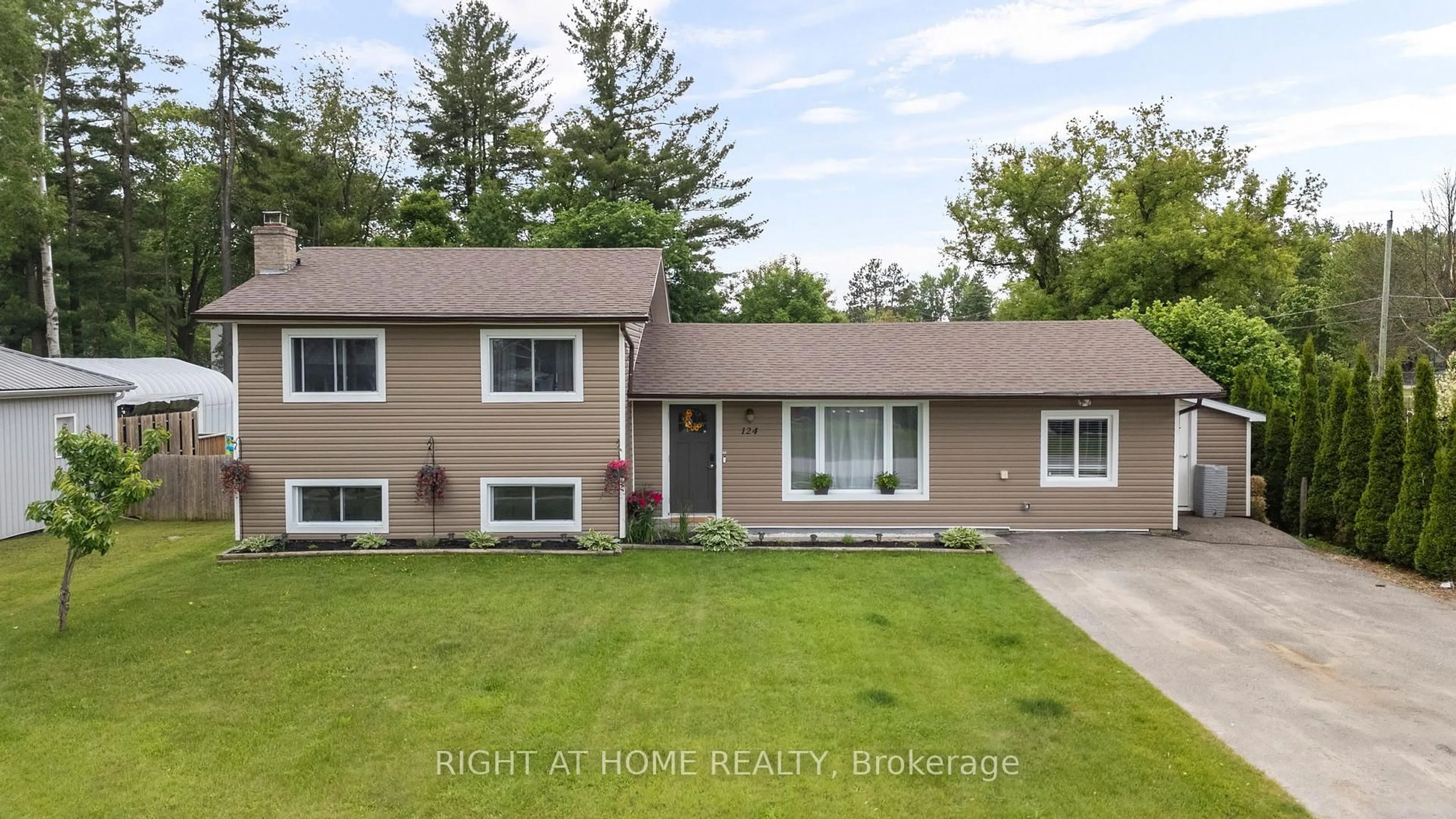 Home with vinyl exterior material, street for 124 Sydenham St, Essa Ontario L0M 1B0