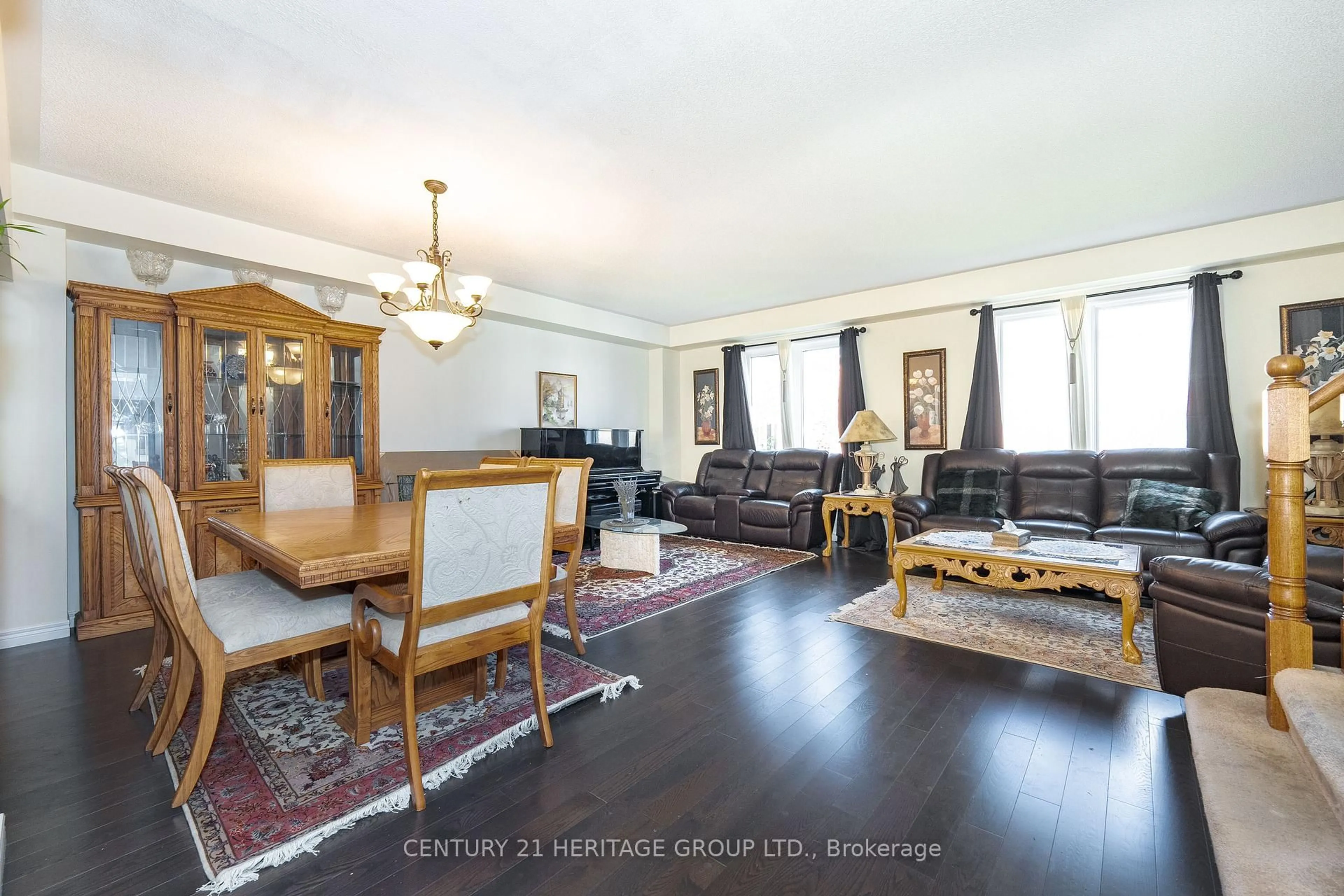 Living room with furniture, wood/laminate floor for 18 Orchid Rd, Markham Ontario L3T 7T6
