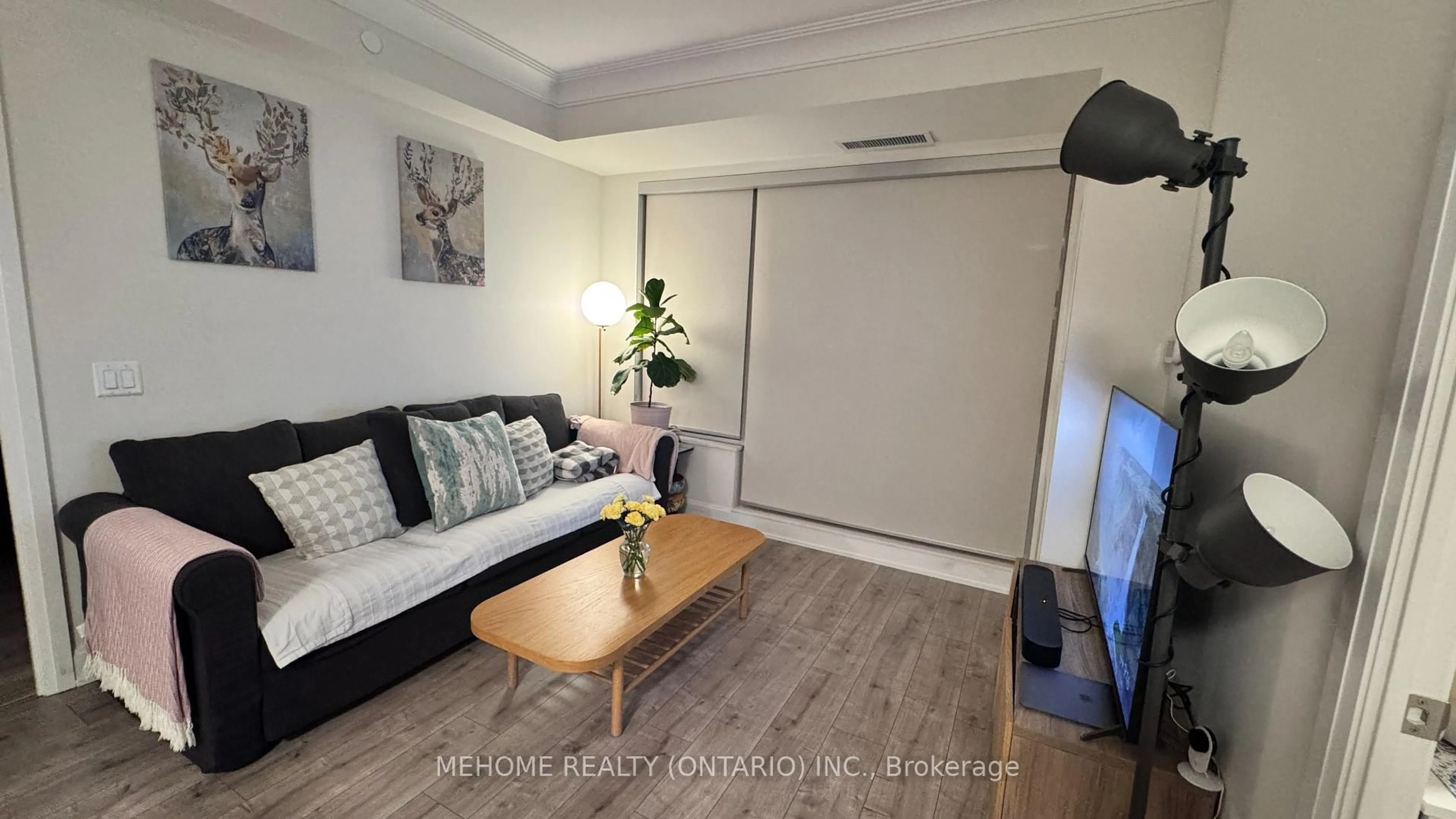 Living room with furniture, wood/laminate floor for 18 Water Walk Dr #606, Markham Ontario L3R 6L5