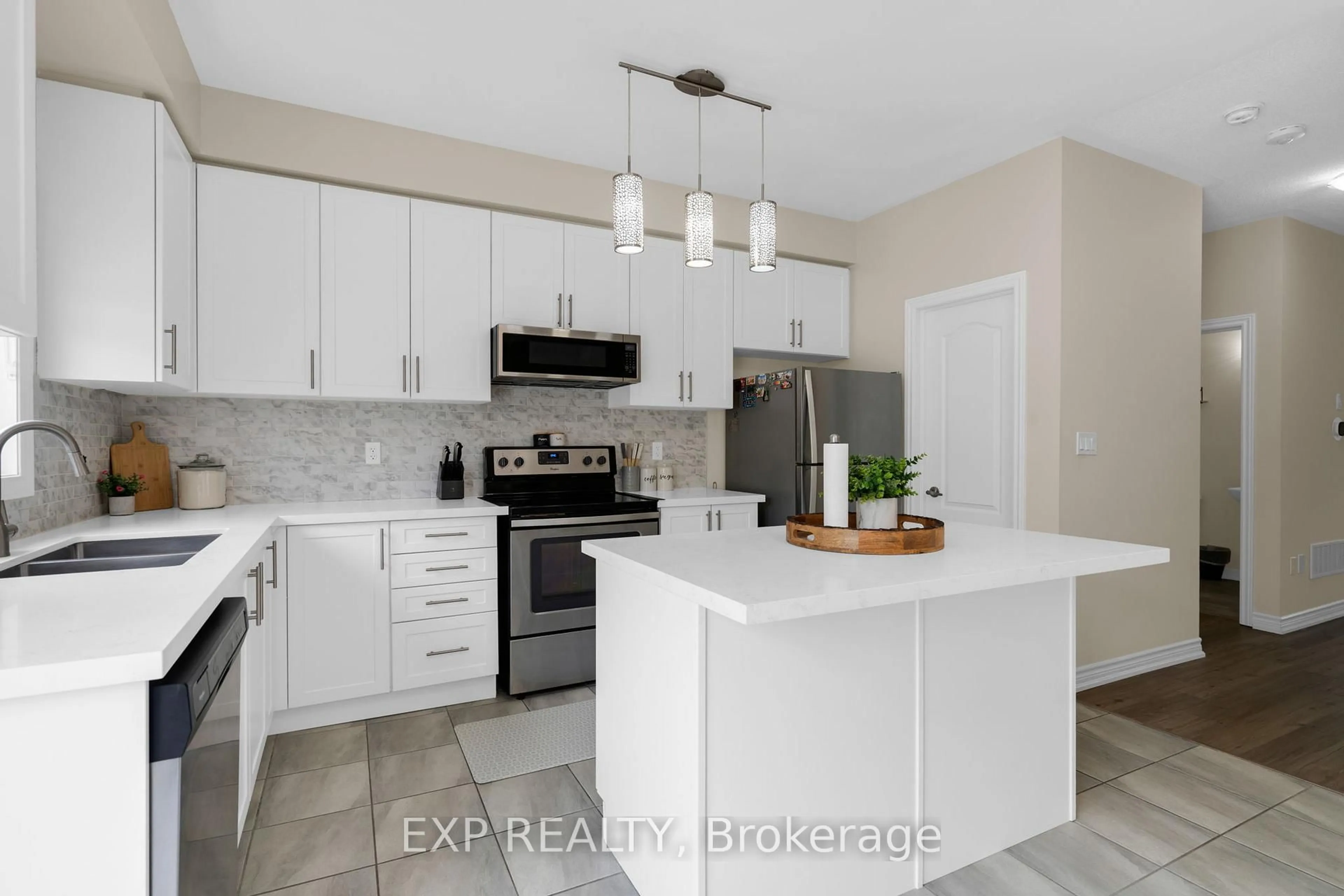 Open concept kitchen, ceramic/tile floor for 57 Milson Cres, Essa Ontario L3W 0C9