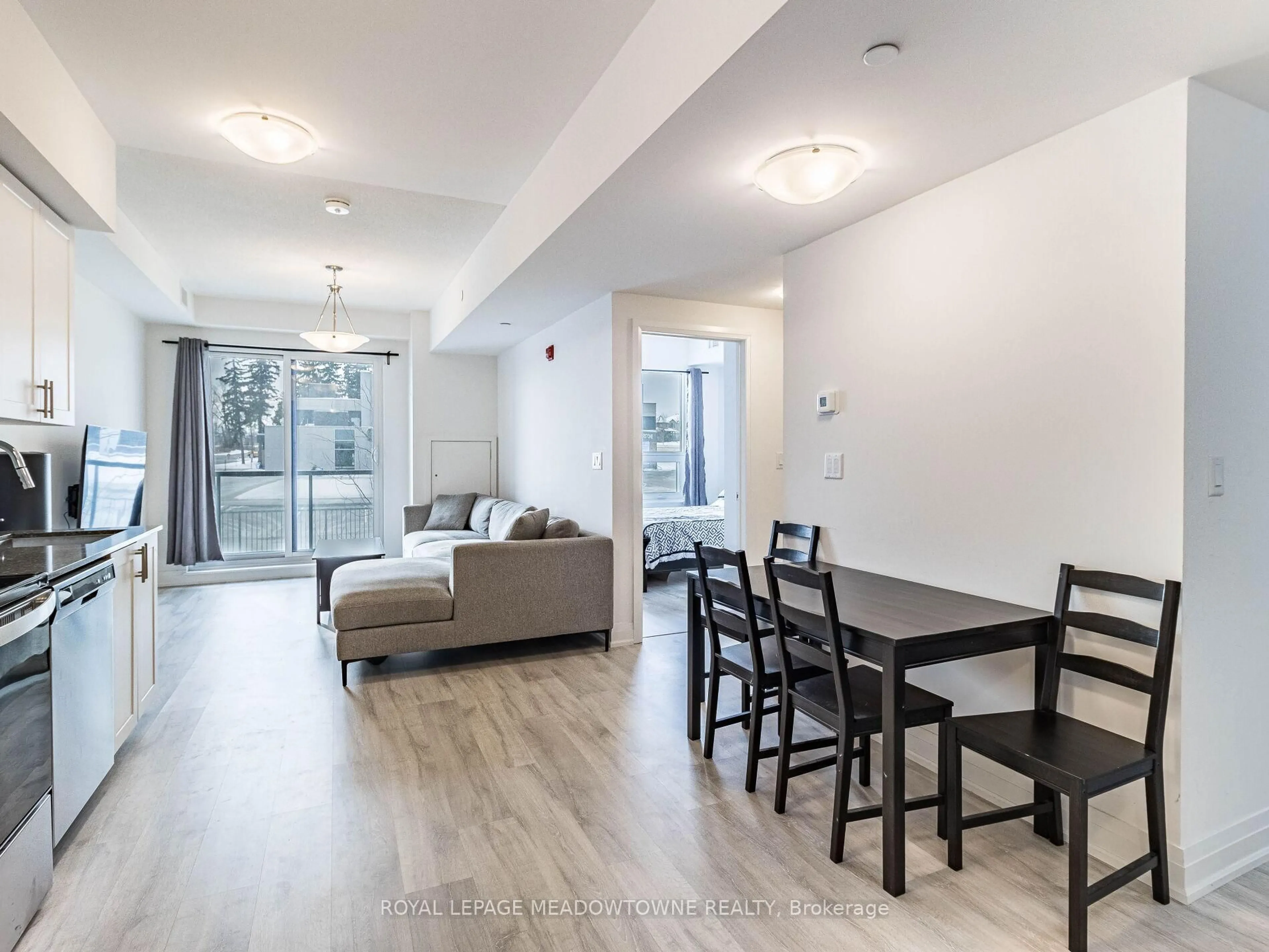 Living room with furniture, wood/laminate floor for 9700 Ninth Line #216, Markham Ontario L6B 1A8