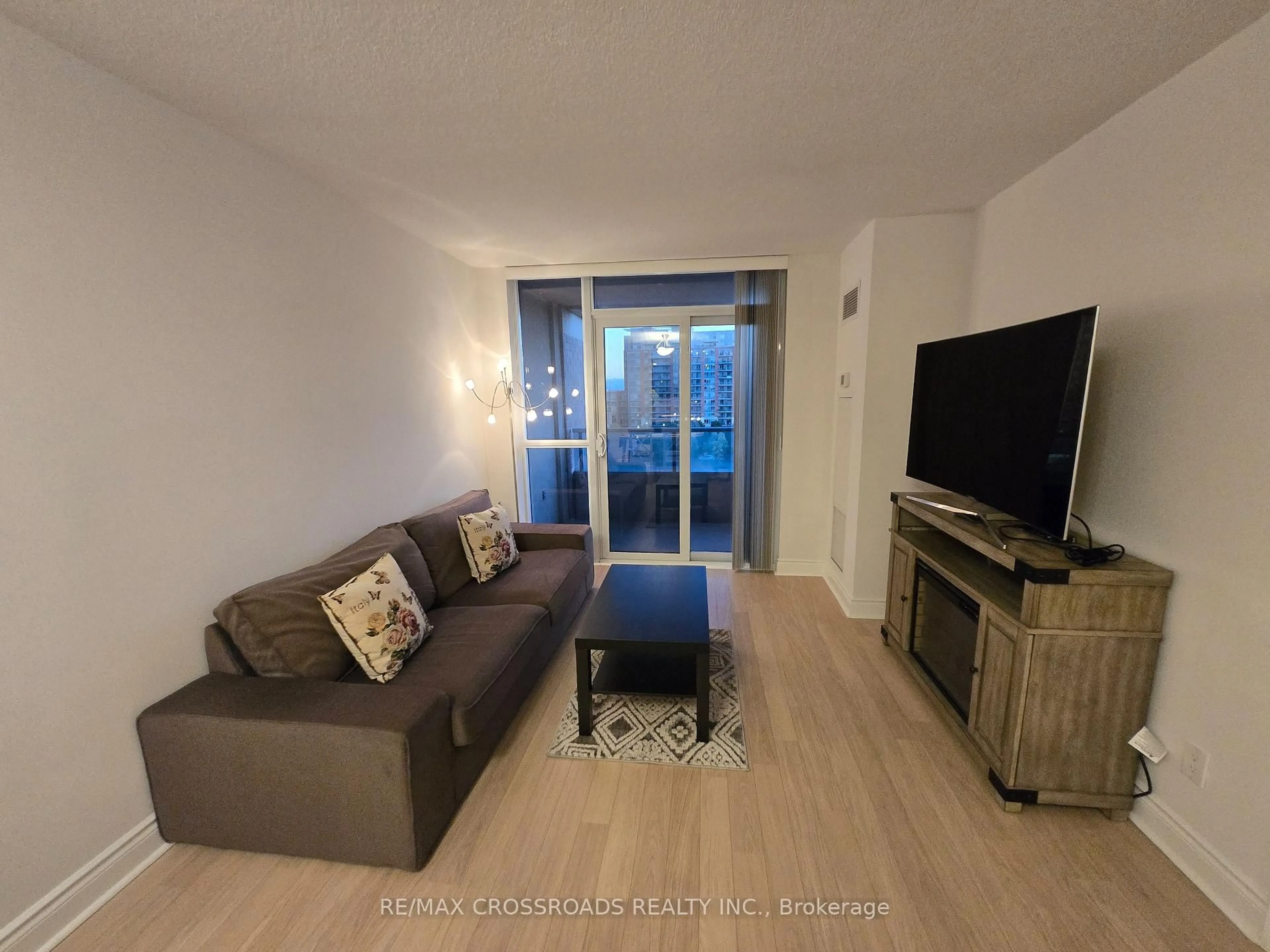 Living room with furniture, wood/laminate floor for 23 Cox Blvd #659, Markham Ontario L3R 7Z9
