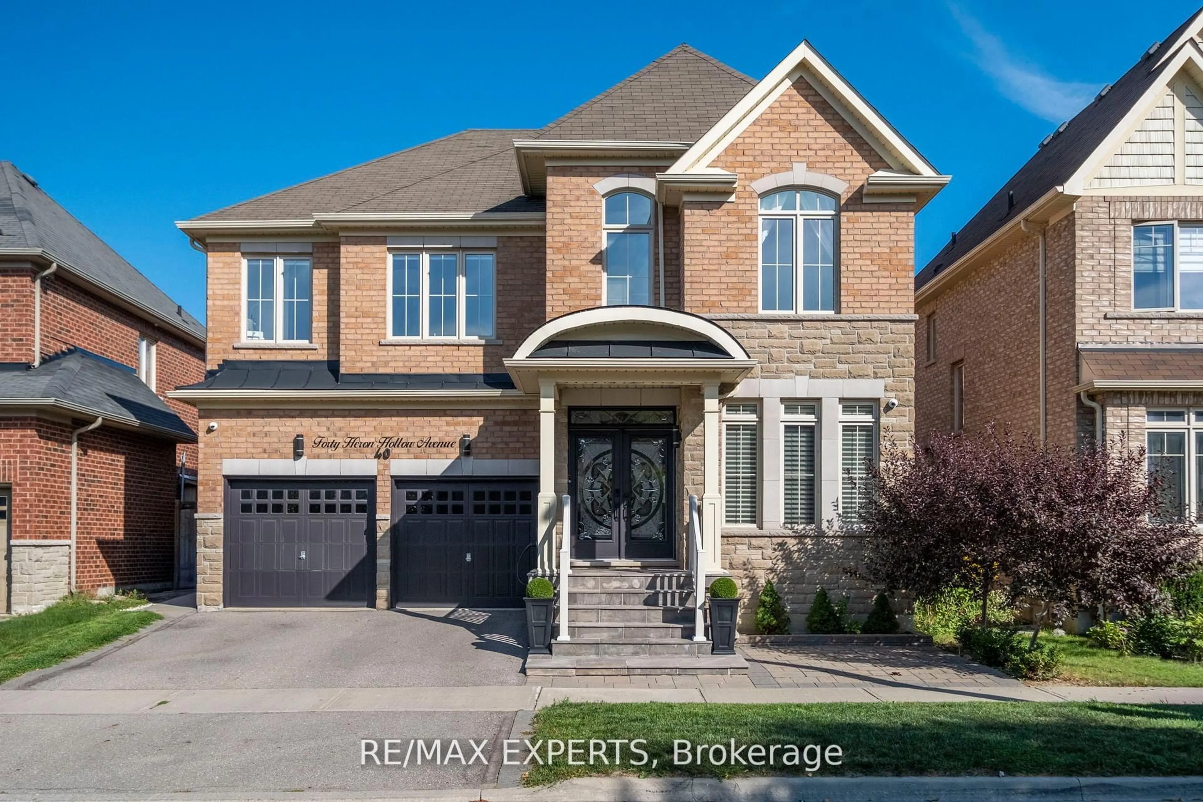Home with brick exterior material, street for 40 Heron Hollow Ave, Richmond Hill Ontario L4E 0G9