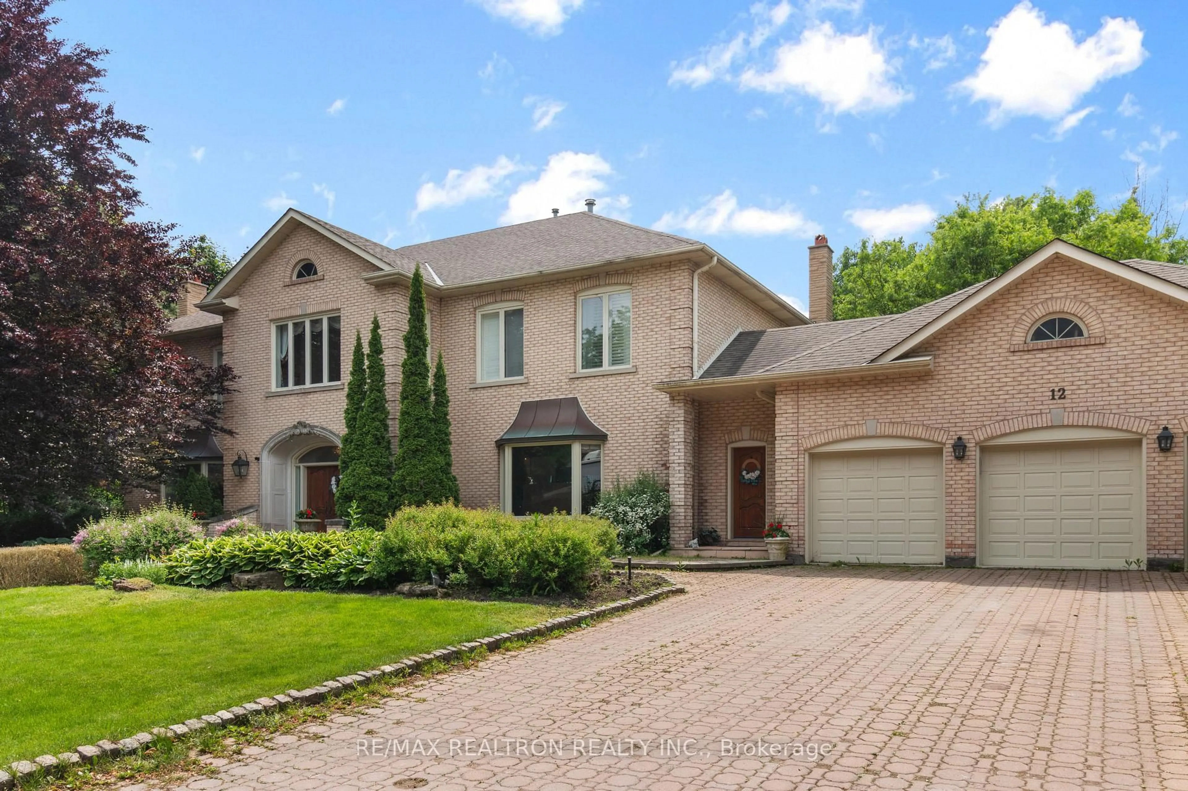 Home with brick exterior material, street for 12 Moodie Dr, Richmond Hill Ontario L4C 8C9