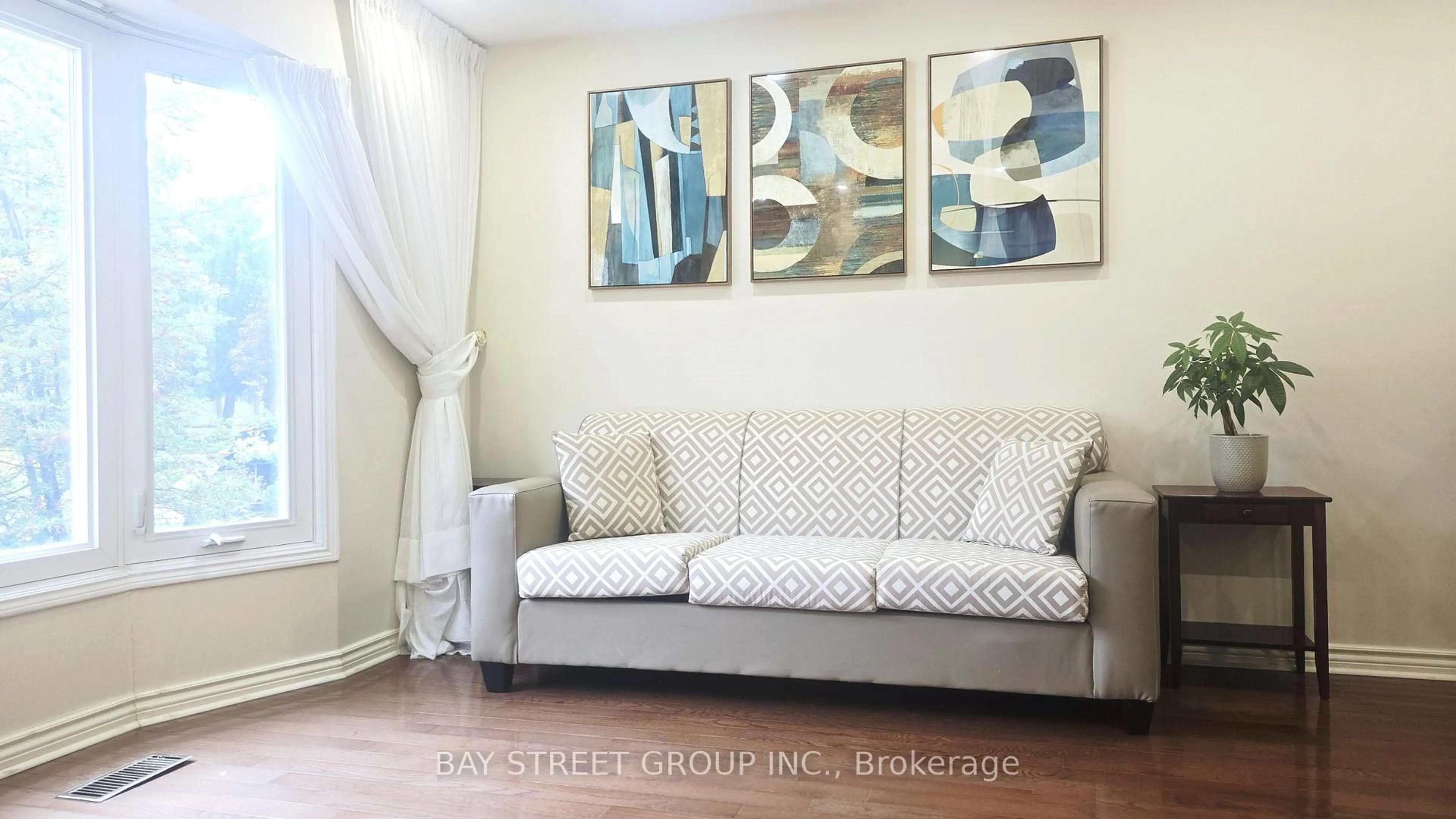 Living room with furniture, wood/laminate floor for 24 Beasley Dr, Richmond Hill Ontario L4C 7Z2