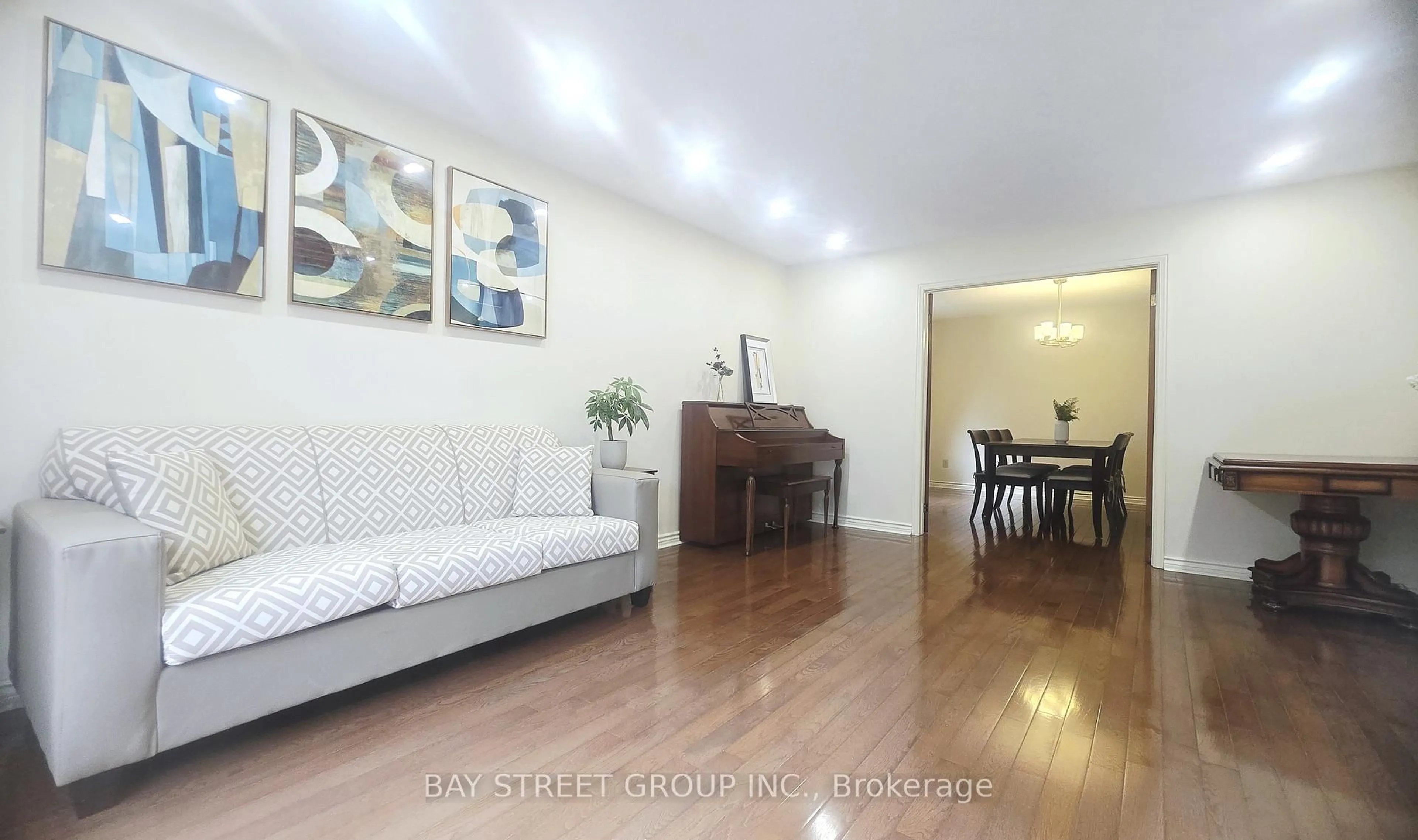 Living room with furniture, wood/laminate floor for 24 Beasley Dr, Richmond Hill Ontario L4C 7Z2